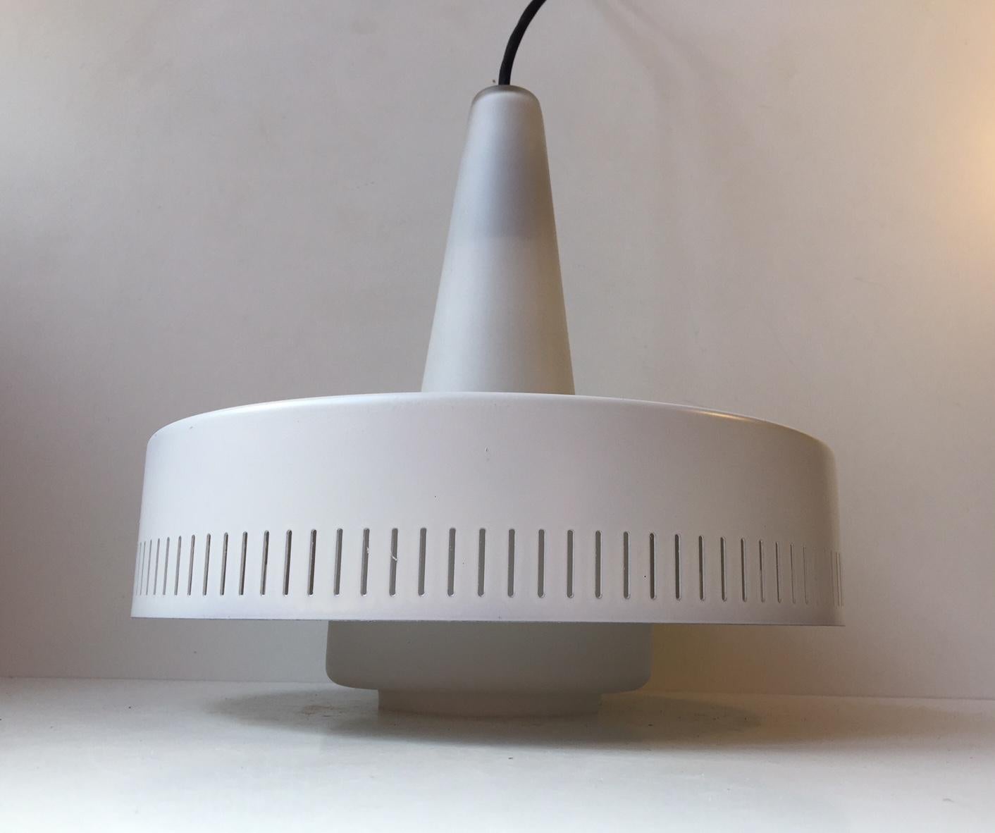 Danish ceiling light designed by Bent Karlby for Lyfa, Denmark and manufactured in the late 1950s. The light consists of white lacquered shade with vertical perforations to the edge and opaline glass shade. Very nice vintage condition, only with one