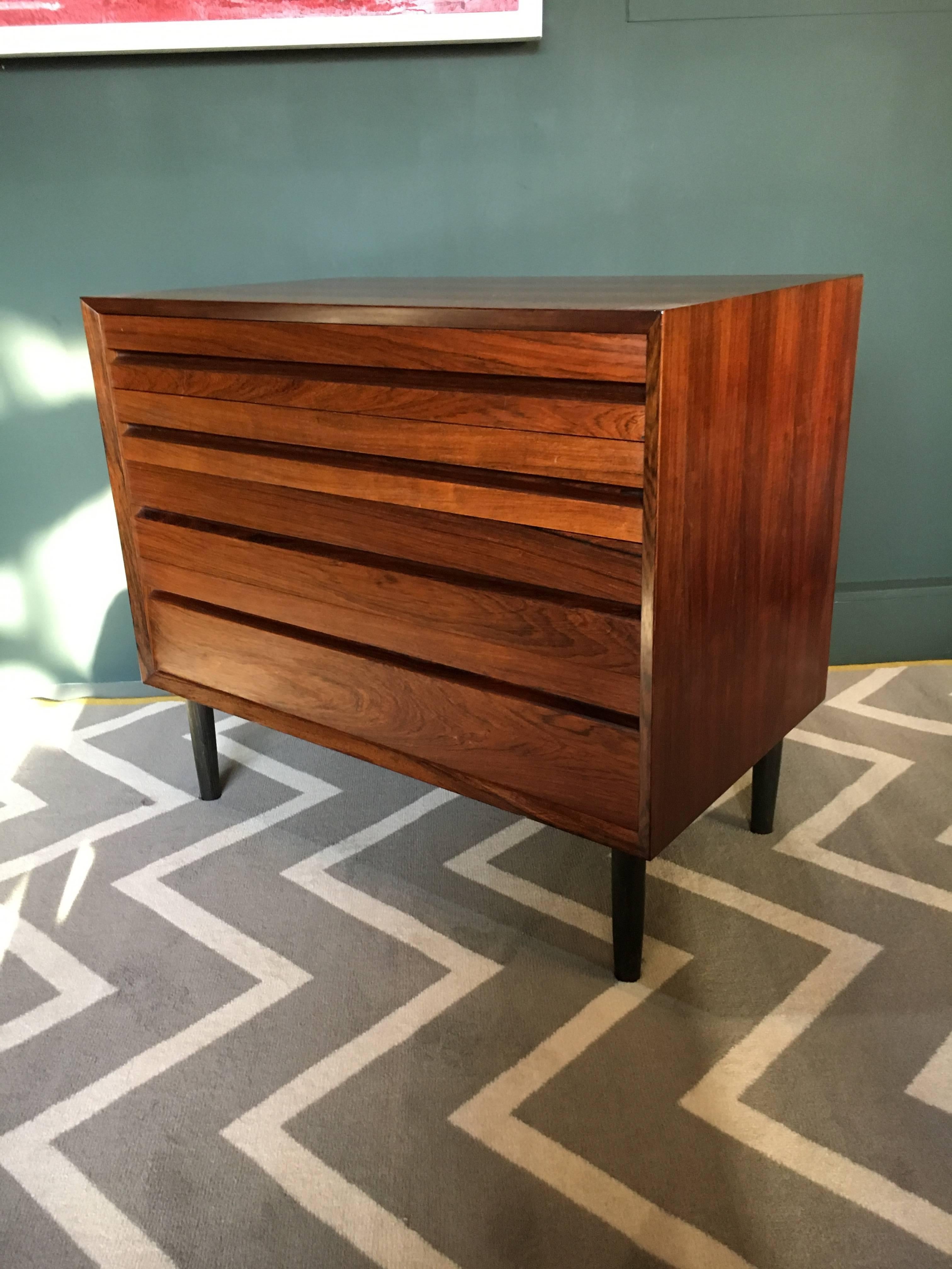 A lovely mid-size chest of drawers from Denmark, circa 1960. Excellent modernist midcentury design details. Repolished.
 