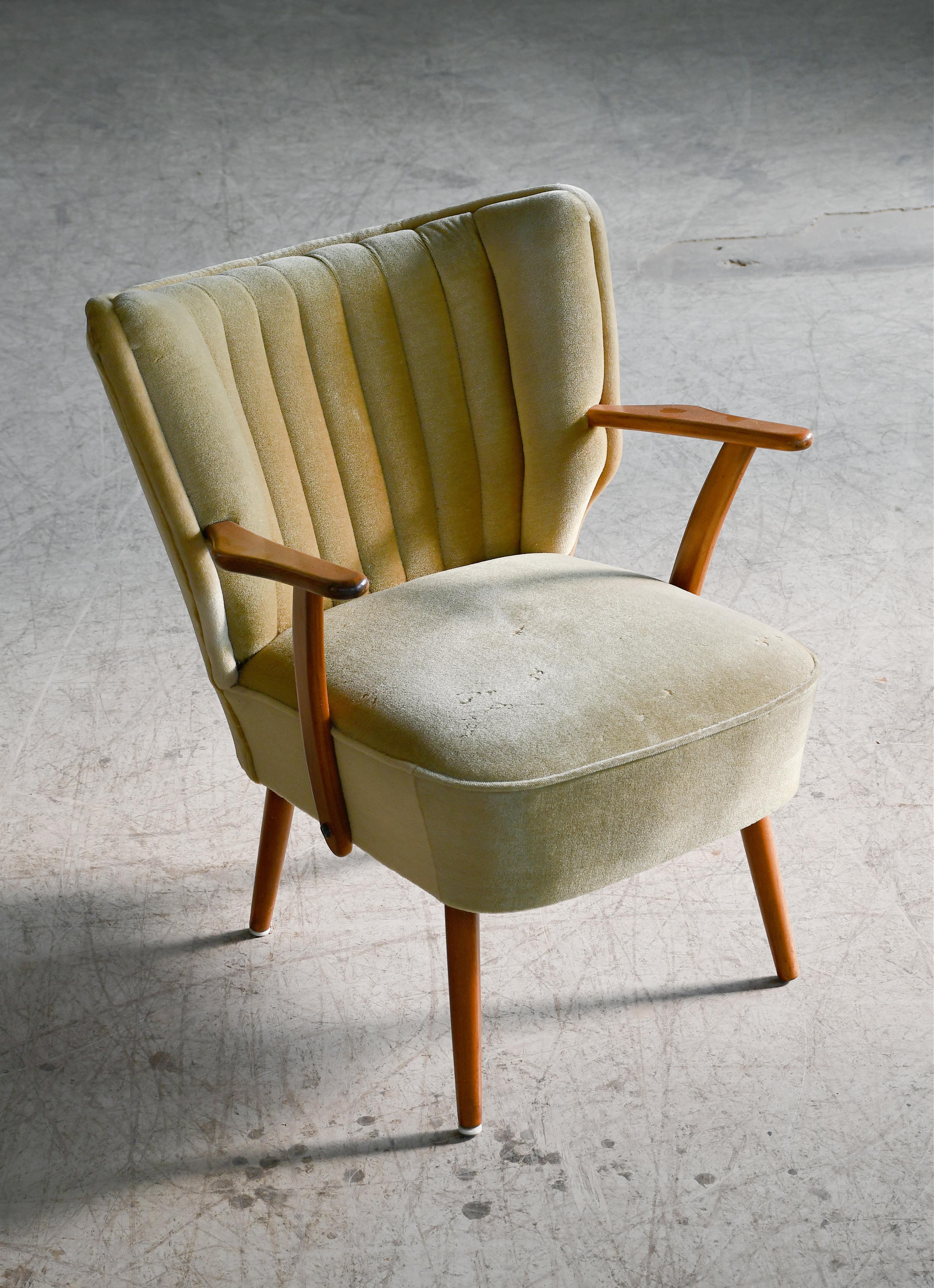 A very cool  Danish slipper or cocktail chairs from the 1950s. Very comfortable and light weight and thus easy to move around when the situation and guests require extra seating. Well crafted sturdy construction. Still usable wool velvet fabric. We
