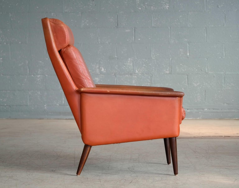 Danish Midcentury Cognac Colored High Back Lounge Chair with Ottoman by