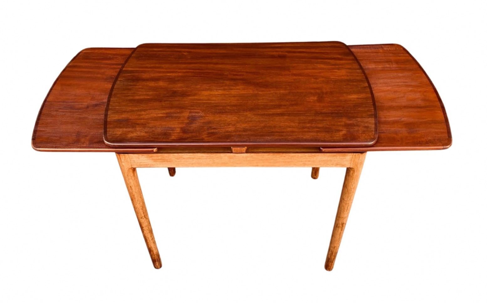 Elegant and smart console table/coffee table in mahogany.

Designed and made in Denmark I the 1950s.

Refurbished and in excellent condition.

Length without extensions: 74cm.