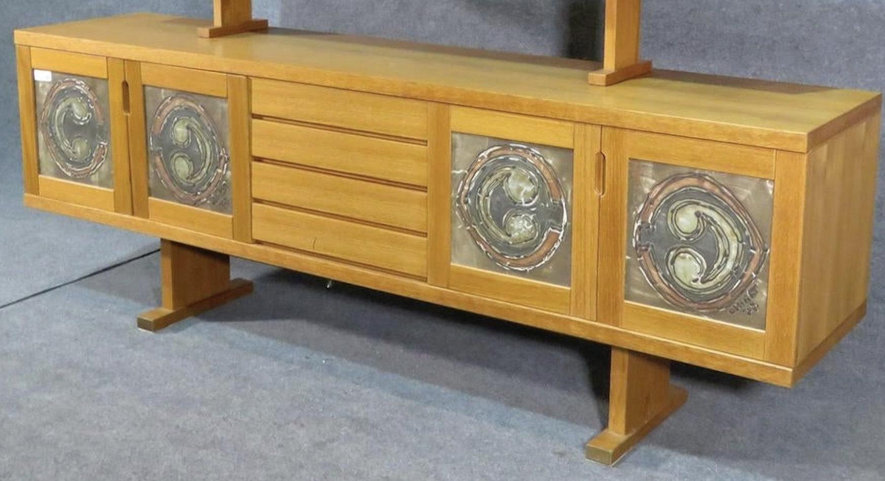 Tile front credenza in teak wood grain. Two door cabinets and four drawer middle storage.
(Please confirm item location - NY or NJ - with dealer).
 