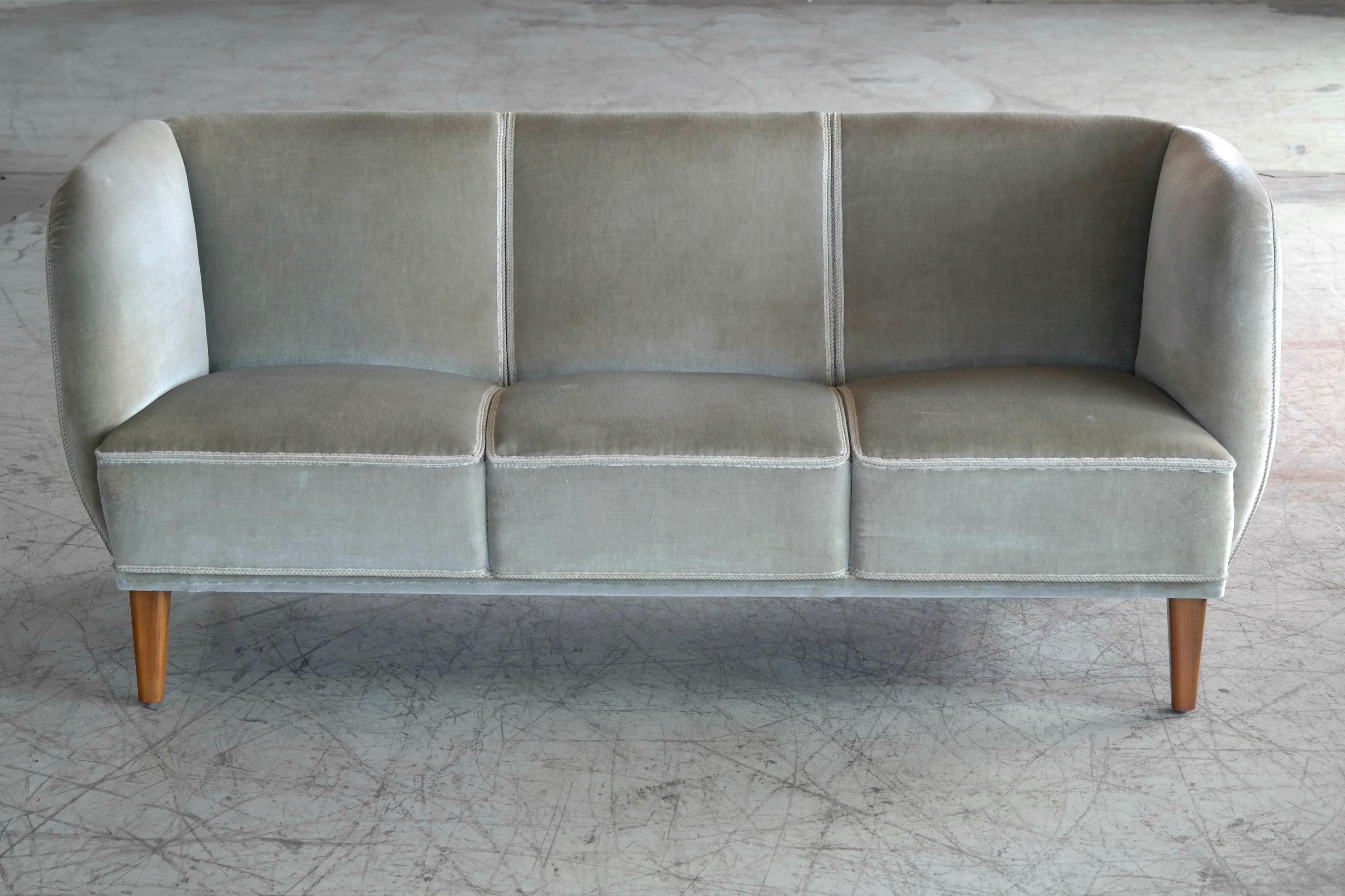 1940s Danish curved sofa often referred to by the Danes as banana form sofa. This sofa has a really nice elegant lines very reminiscent of Viggo Boesen and Ludvig Pontoppidan and we love the combination of the mohair fabric with the channels in the