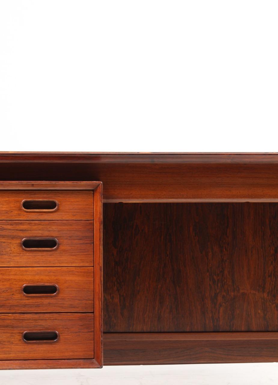 Freestanding desk in rosewood designed by Arne Vodder and made by Sibast in Denmark in the 1960s. Great condition.