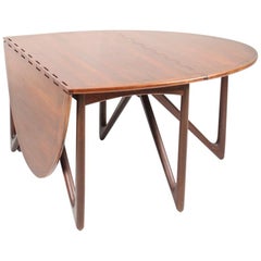 Table de salle à manger danoise du milieu du siècle dernier en bois de rose par Kurt stervig, années 1960