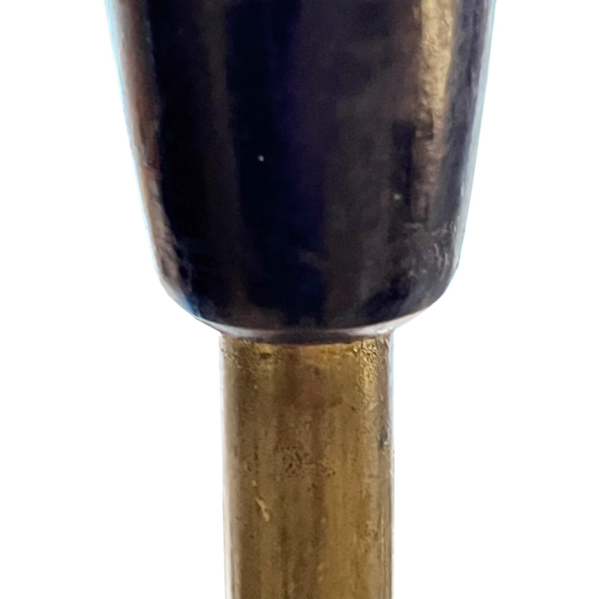 This stylish floor lamp was made in Denmark in the 1960s.

Crafted from carved ebonised wood and brass it has an elegant column - 152cm to the top of the fitting.

Pictured with a bespoke shade which we sell separately. 

We've had this light