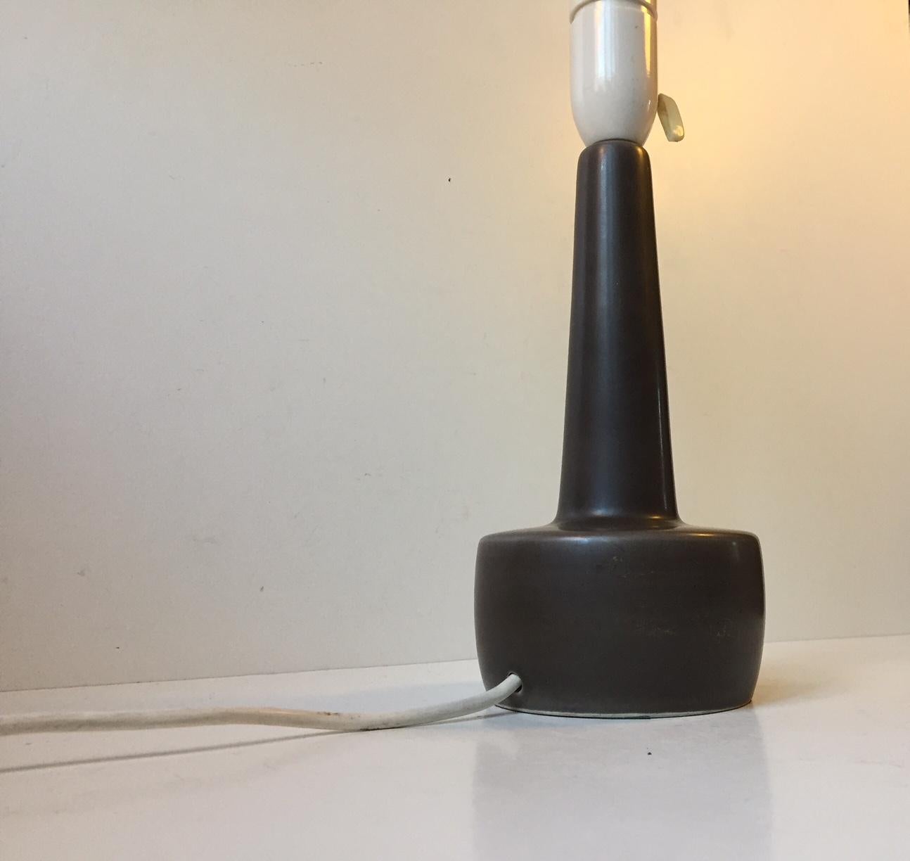 Danish ceramic table lamp with a dense grey hares fur type glaze. Similar to the techniques popularized by Bernt Friberg and Palshus. It was manufactured by Søholm in Denmark during the 1960s. Designed by RA, not identified. It comes without the