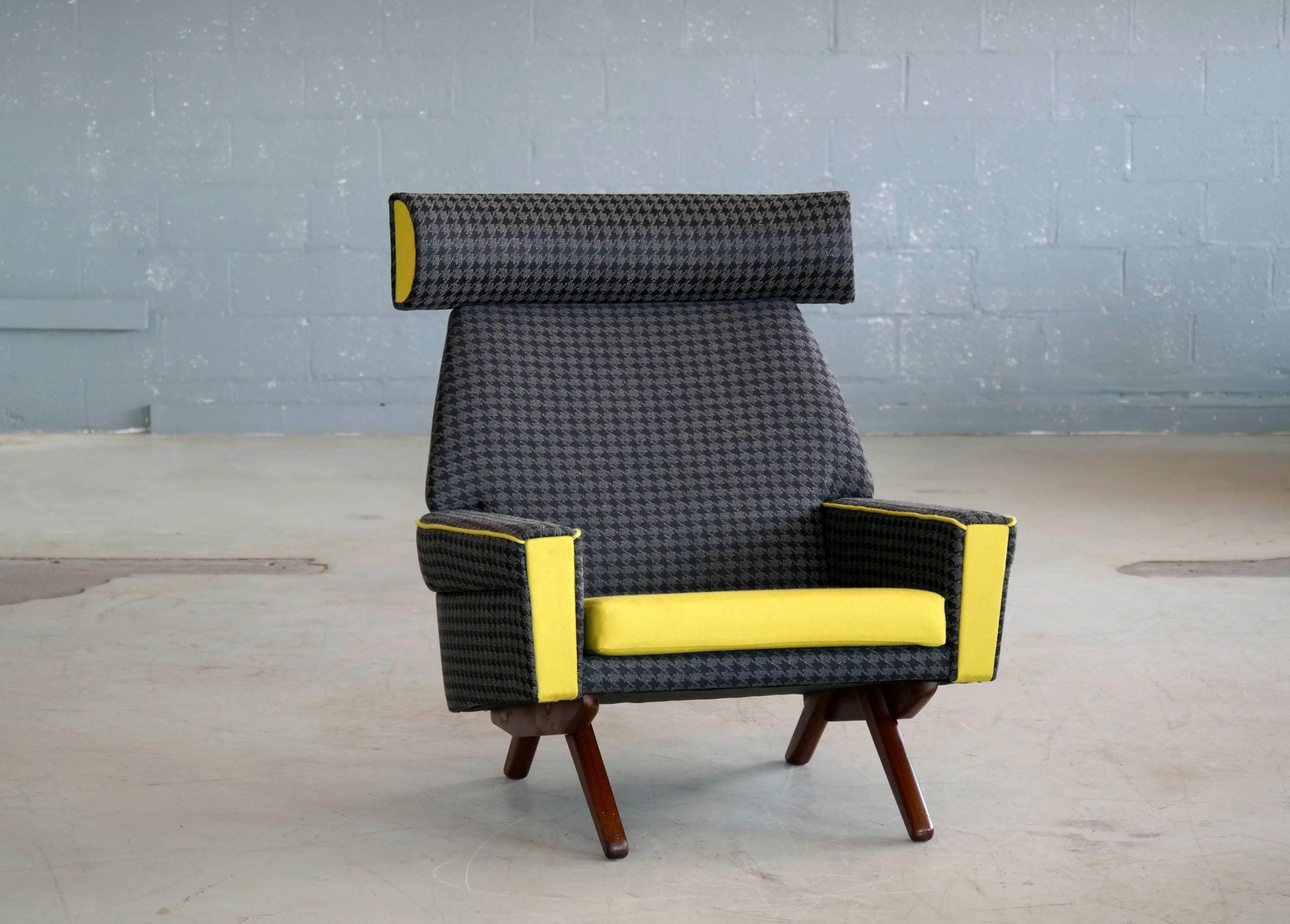 This rare chair was designed in the early 1960s by Leif Hansen and manufactured by Kronen which was a short-lived manufacturer of Danish high quality midcentury Furniture producing mainly designs by Leif Hansen. Newly upholstered in houndstooth