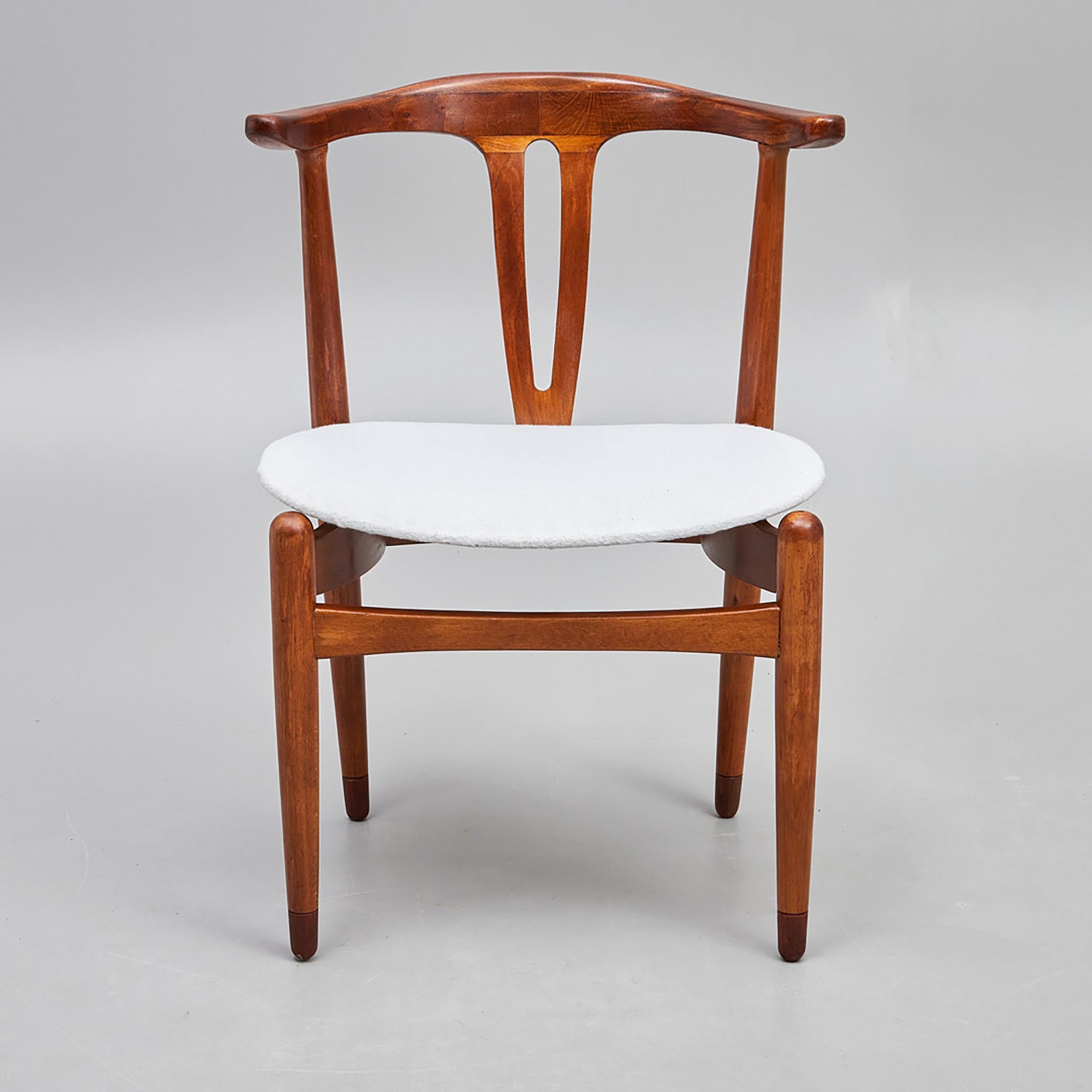 Hardwood frame, upholstered seat. Made in Denmark in the 1950s.