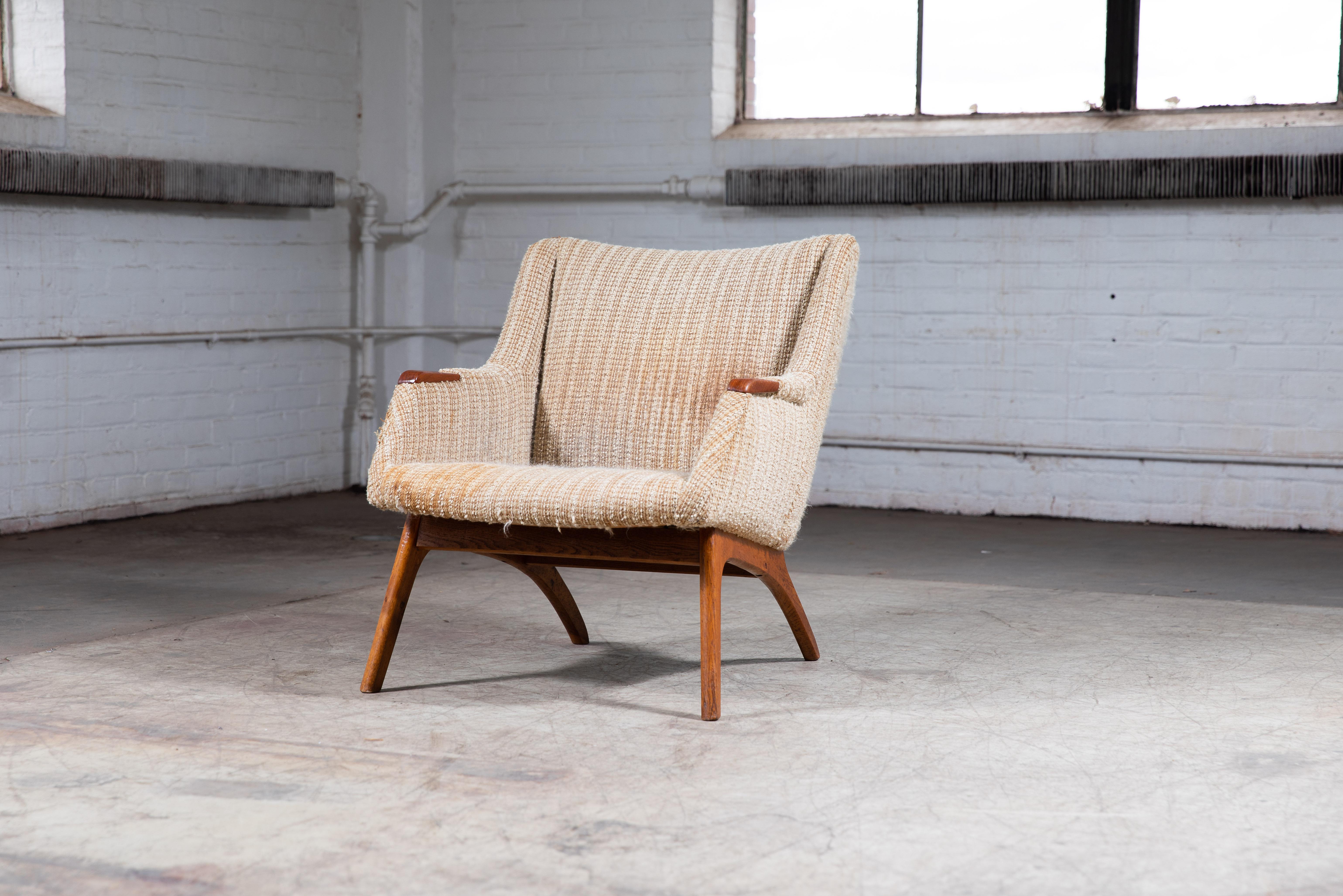 Nice light and versatile easy chair in the style of Kurt Olsen. Great for a smaller room where space is an issue and you may want to be able to move the chair around. The frame and armrest are made of teak with nice color and patina. The original