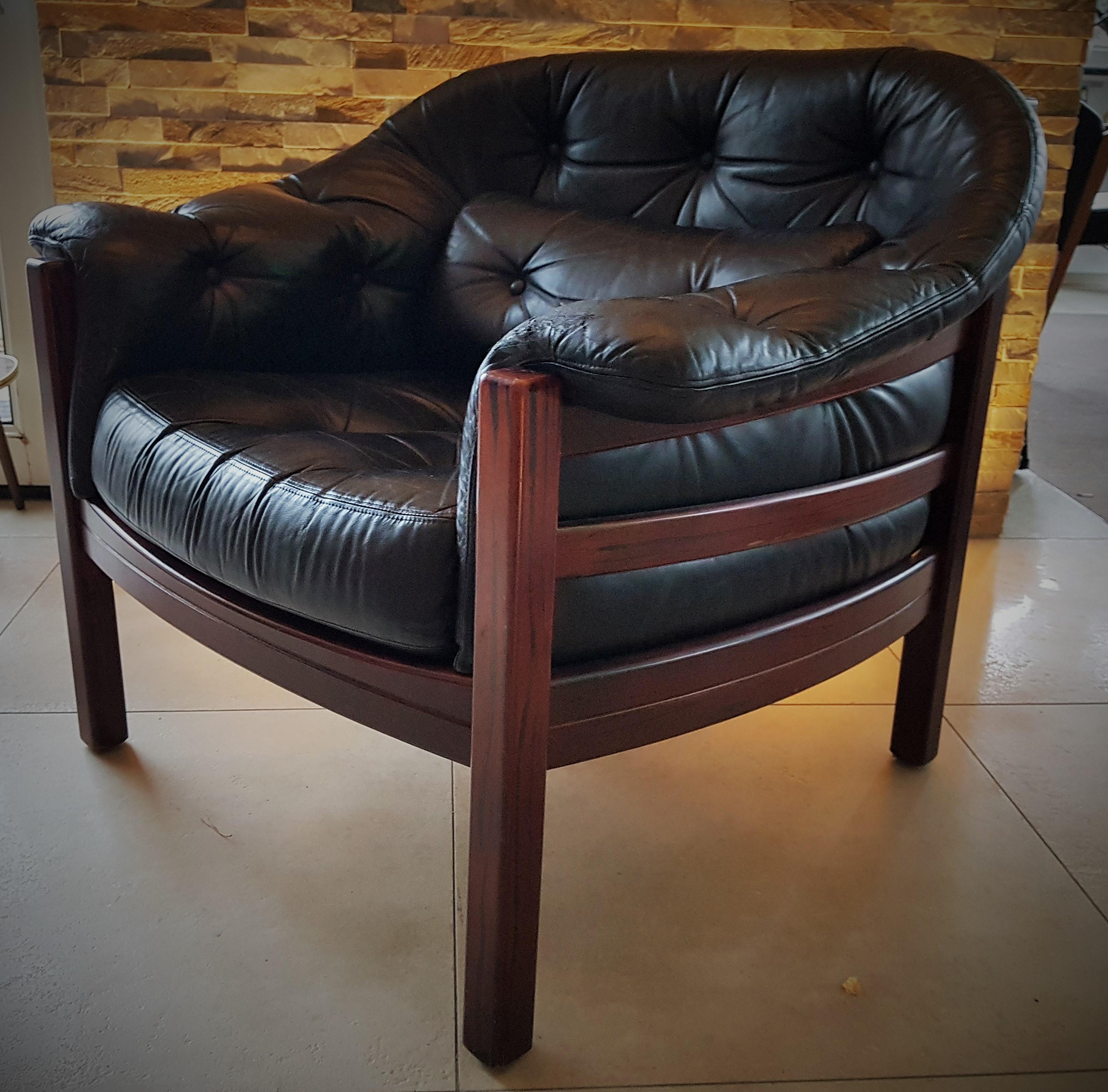 Danish Arne Norell lounge chair in teak wood and black leather, 1960s. Small leather damage left arm wrist, please watch pictures! stabile and solid, wood frame in perfect condition. Upholstery in good condition. All-over good vintage condition.