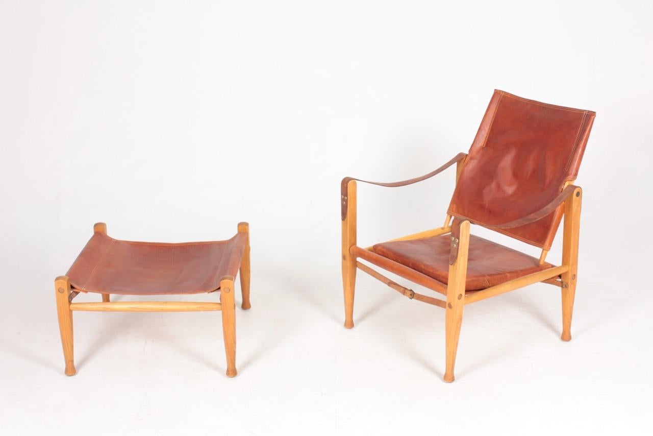 Safari chair and ottoman in leather. Designed by Maa. Kaare Klint for Rud Rasmussen cabinetmakers of Denmark in 1933. Great original condition.