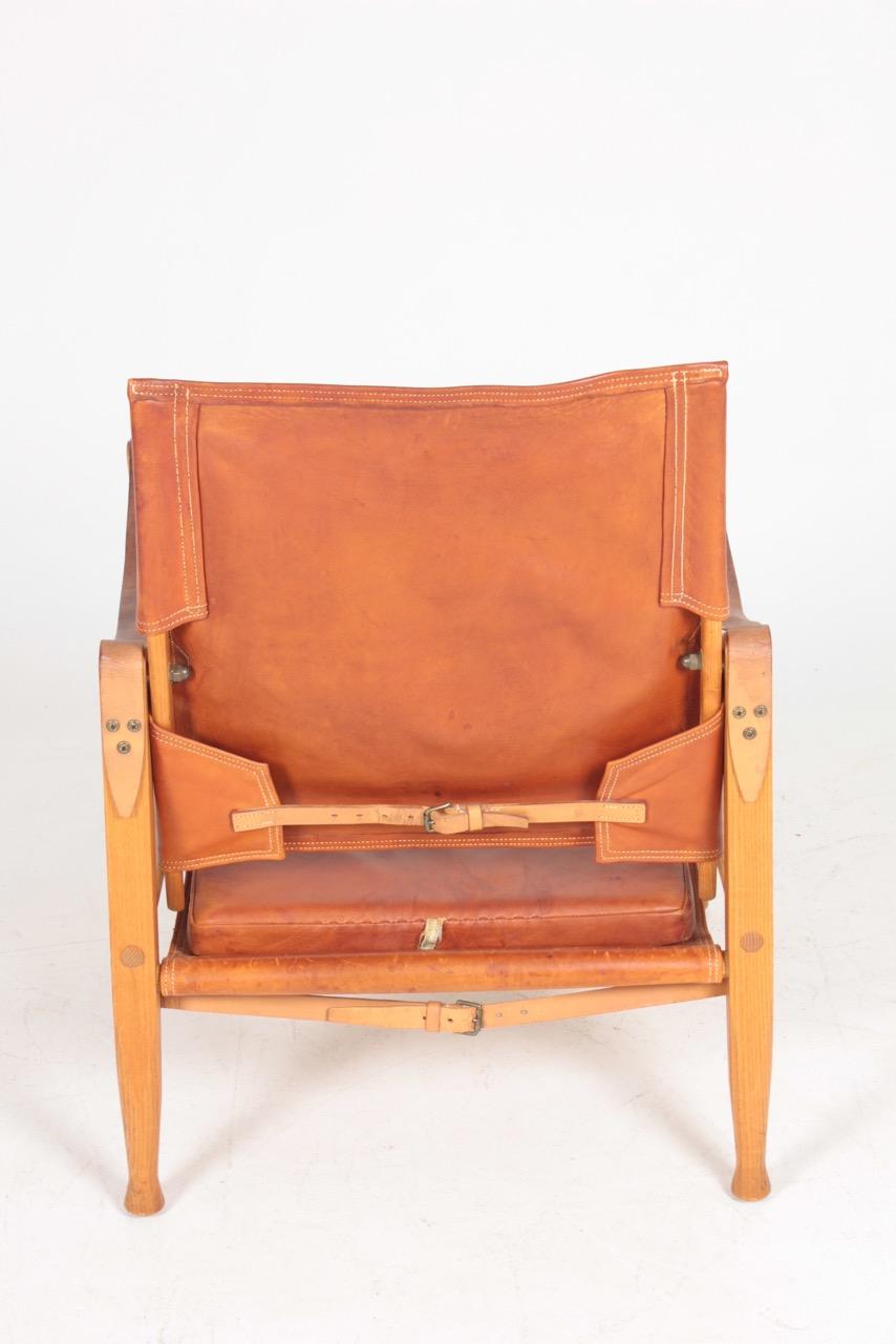 Mid-20th Century Danish Midcentury Lounge Chair & Ottoman in Patinated Leather by Kaare Klint