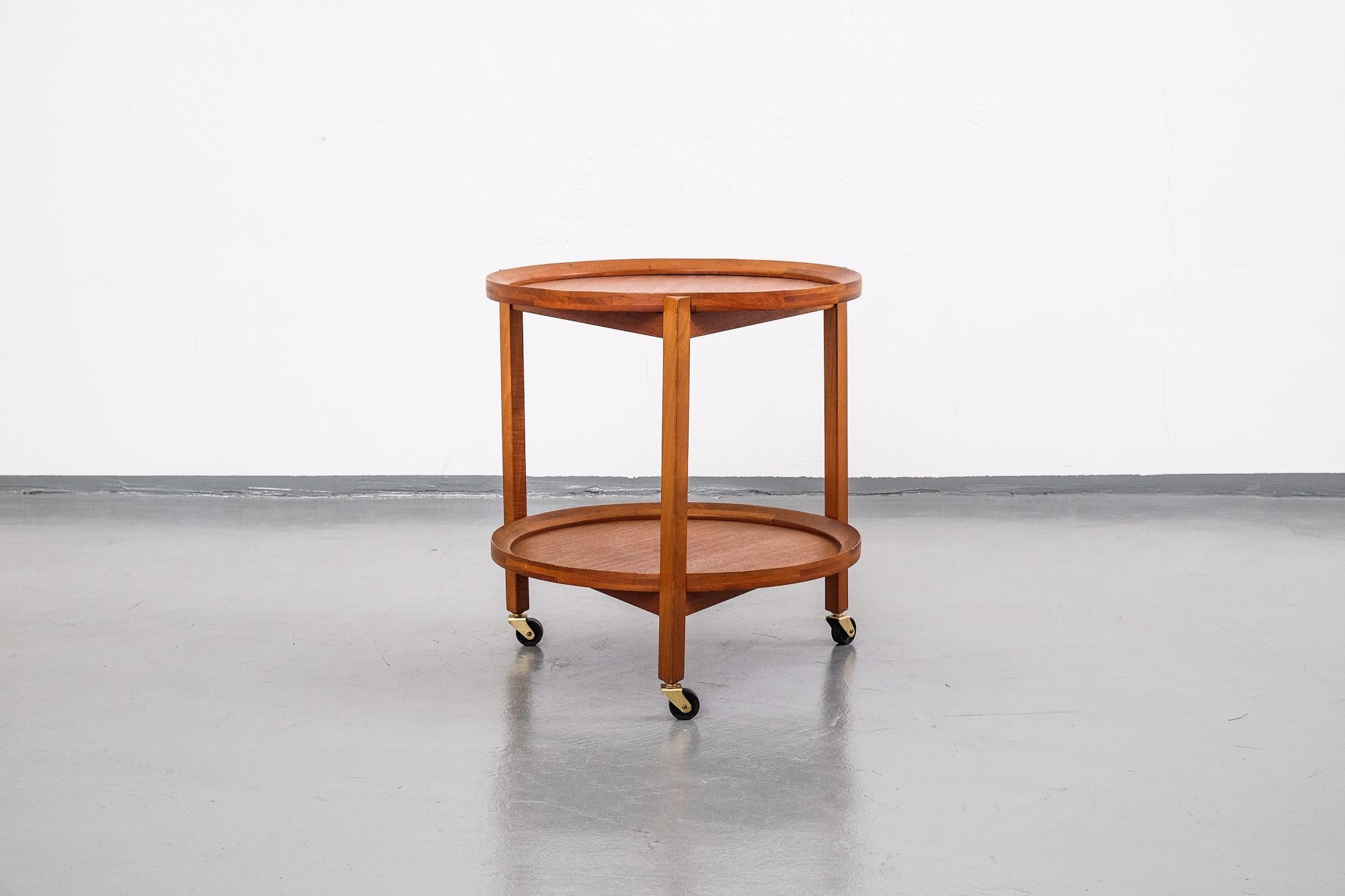 Danish 1960s round teak wood trolley on wheels. Trays are removable and can be used for servicing.