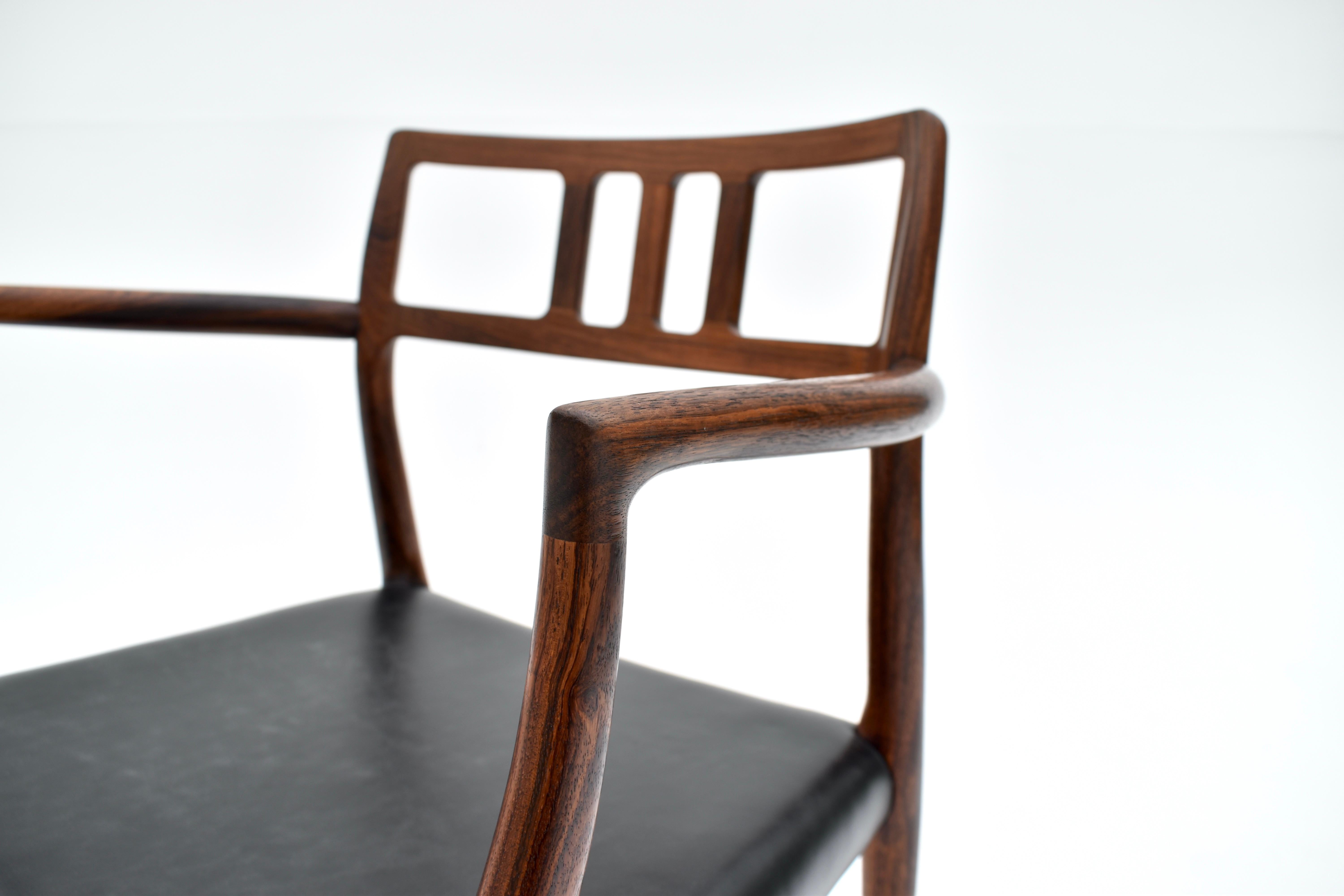 Solid Rosewood and black leather armchair designed by Niels Moller in 1966 for J L Mollers Mobelfabrik.

A highly sought after and rarely seen chair. A Danish design Classic, this design is a showcase for the craftsmanship and and fastidious