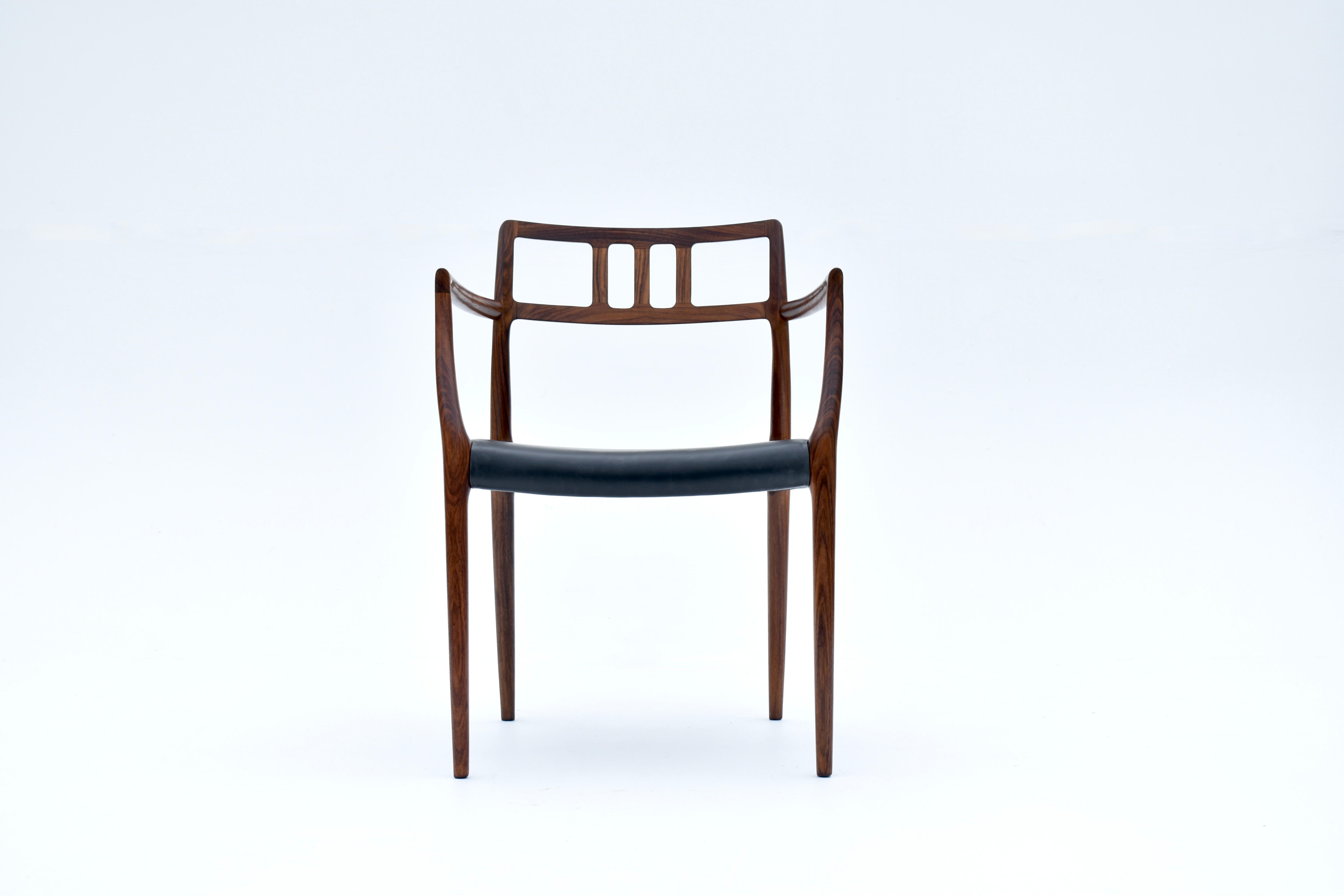 Solid Rosewood and black leather armchair designed by Niels Moller in 1966 for J L Mollers Mobelfabrik.

A highly sought after and rarely seen chair. A Danish design Classic, this design is a showcase for the craftsmanship and and fastidious