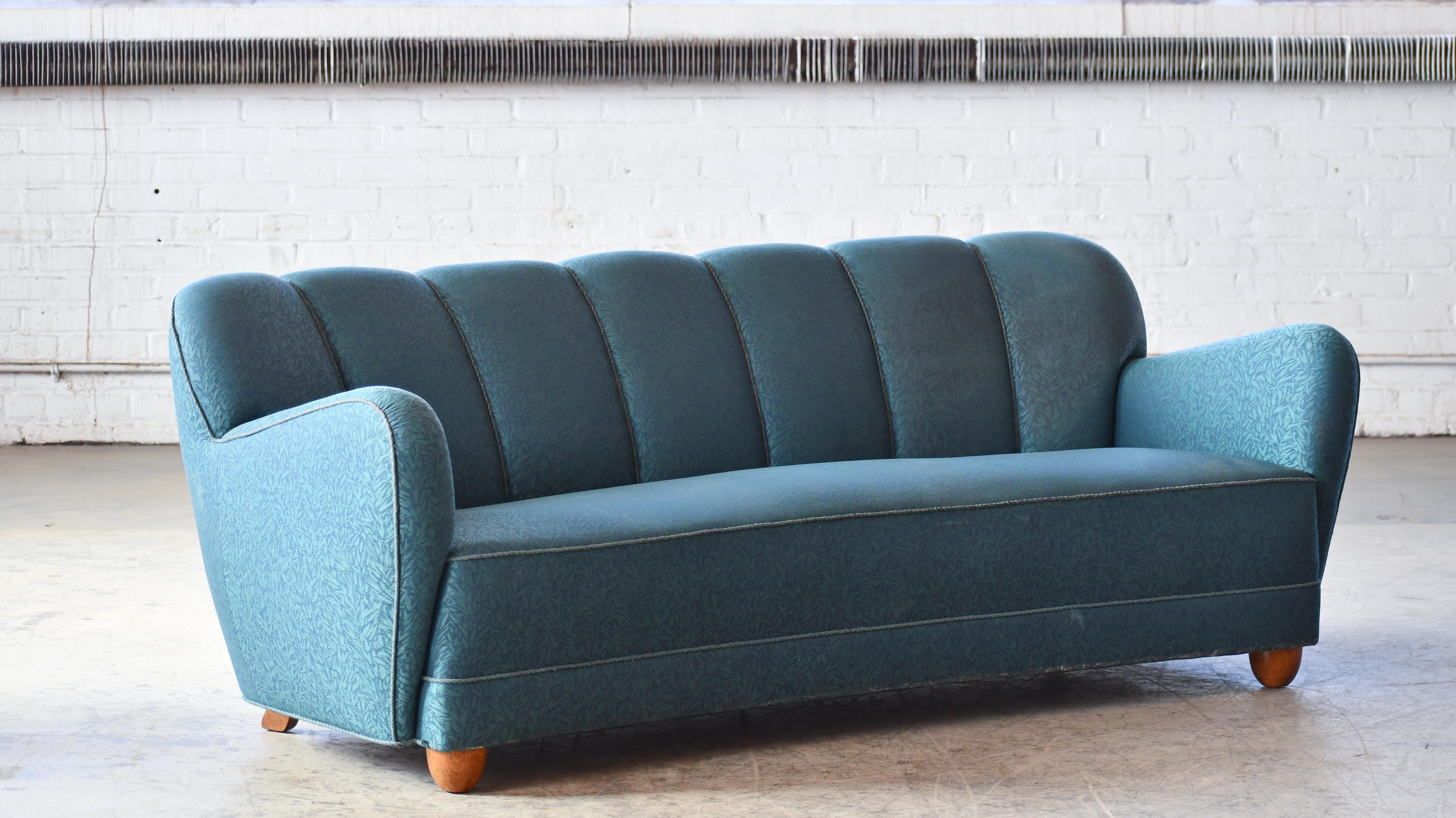 Beautiful Danish three-seat sofa from the 1940s. Similar stance and proportions and seen in Mogens Lassen's iconic designs with his signature rounded armrests but the piece is unmarked and we are not sure of the designer and the maker. We love the