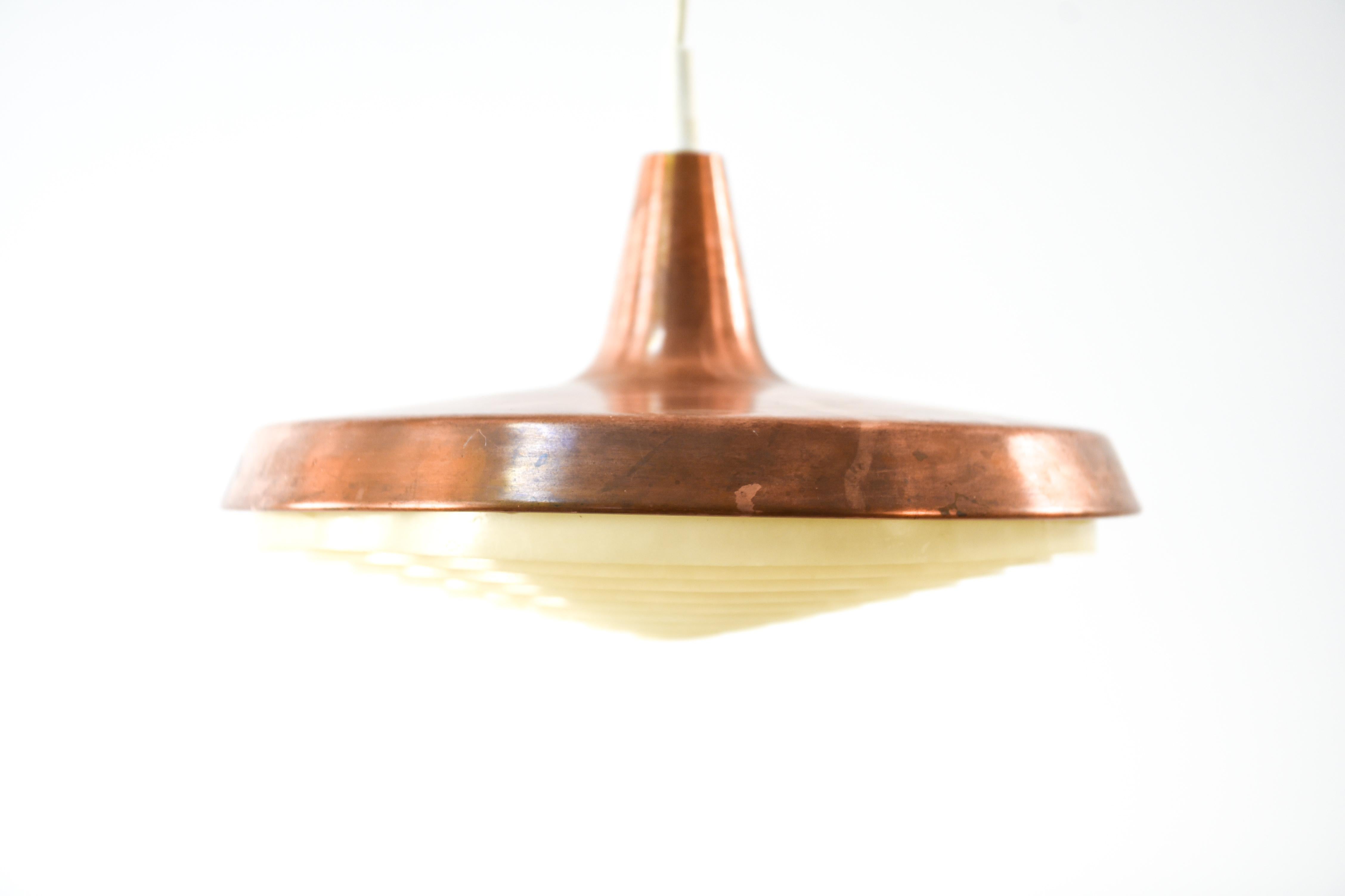 This Danish midcentury pendant light is a great way to incorporate a classic Scandinavian Modern design into an interior in a stylish and functional way. This piece looks great from every angle and would be well suited in a living room or above a