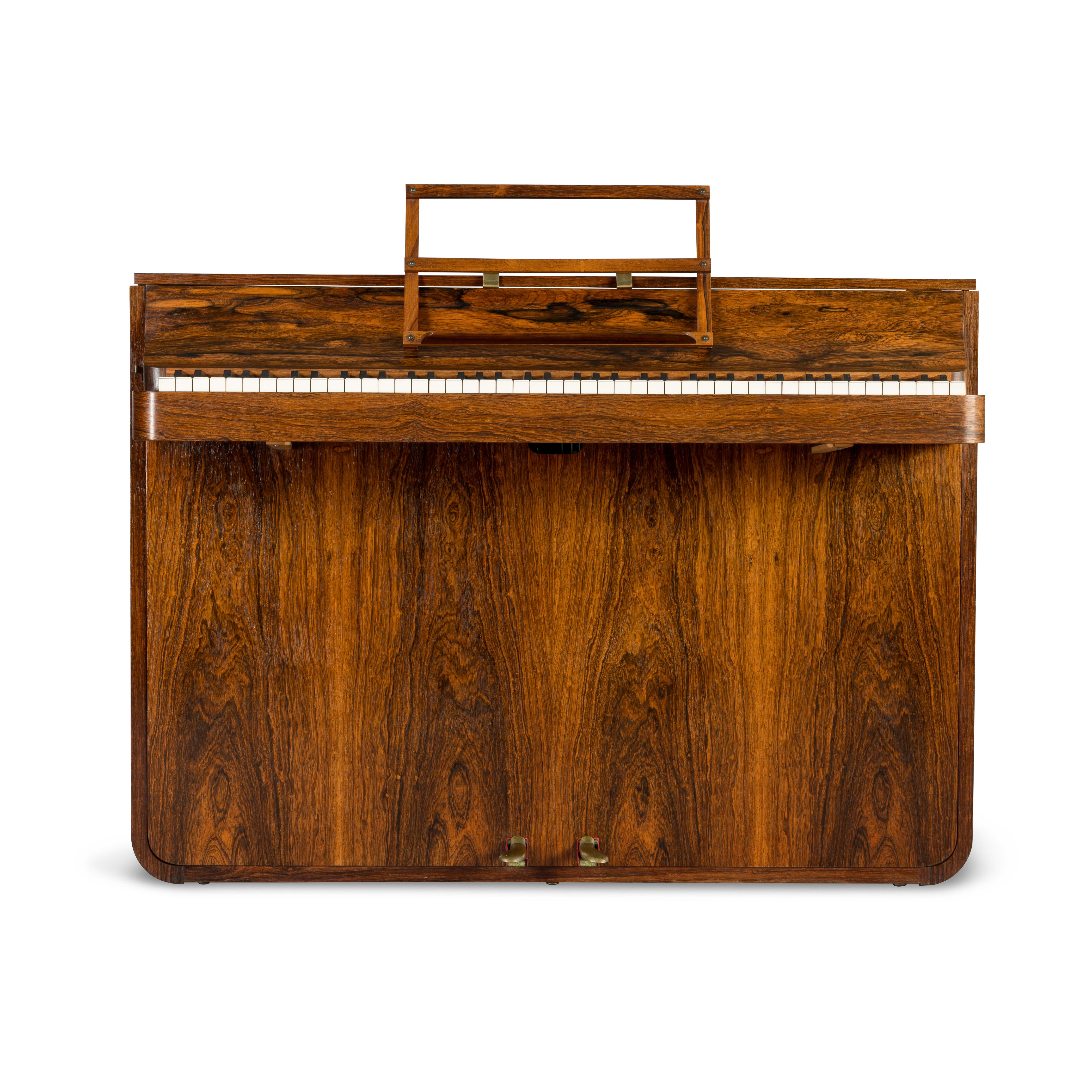 A rare Danish midcentury pianette made of magnificent rosewood. It is called pianette due to the 82 keys rather than the standard 88 of a full size piano. This pianette is made by renowned piano maker Louis Zwicki. Every piano from Louis Zwicki is