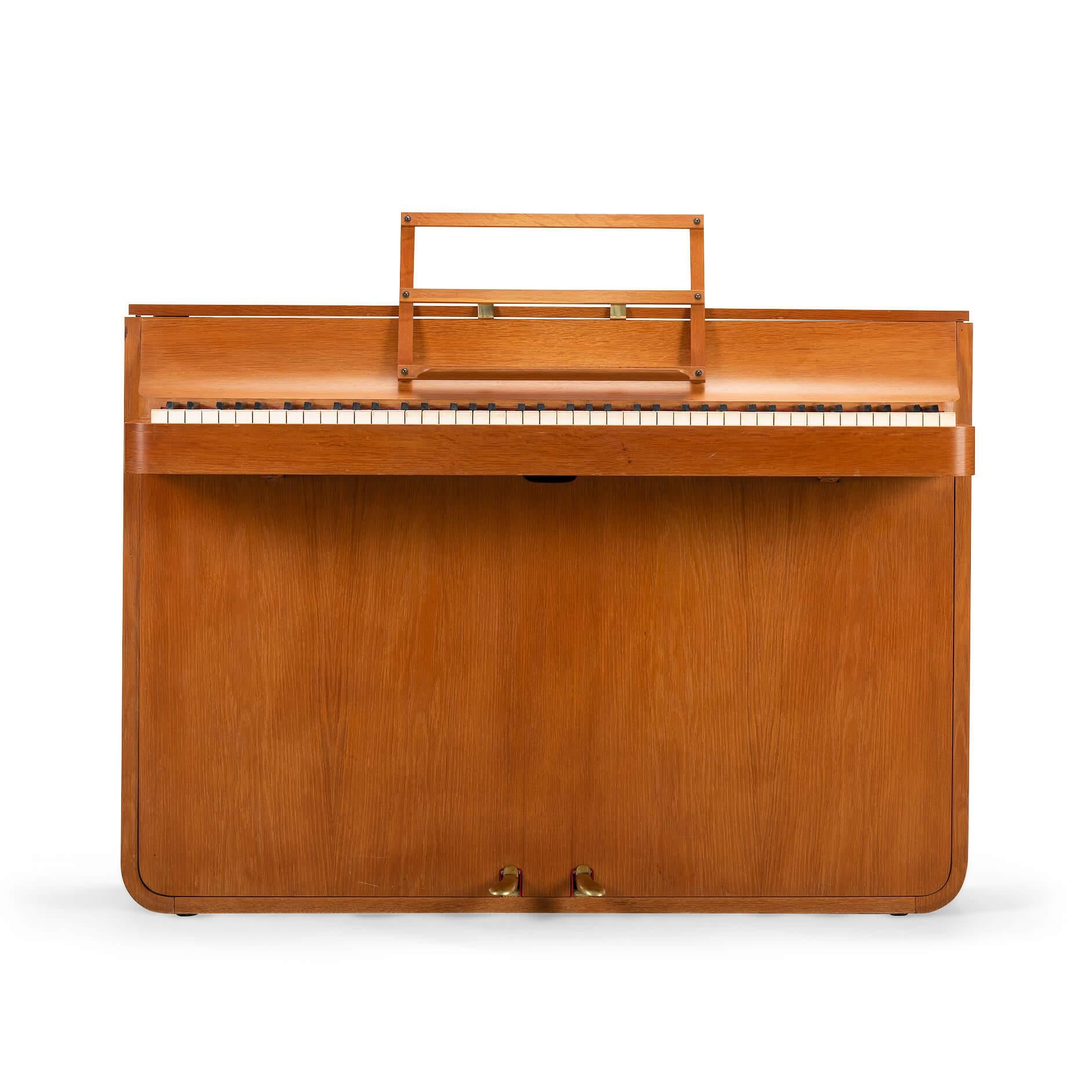 A rare Danish midcentury pianette made of beautiful oak. It is called pianette due to the 82 keys rather than the standard 88 of a full size piano. This pianette is made by renowned piano maker Louis Zwicki. Every piano from Louis Zwicki is