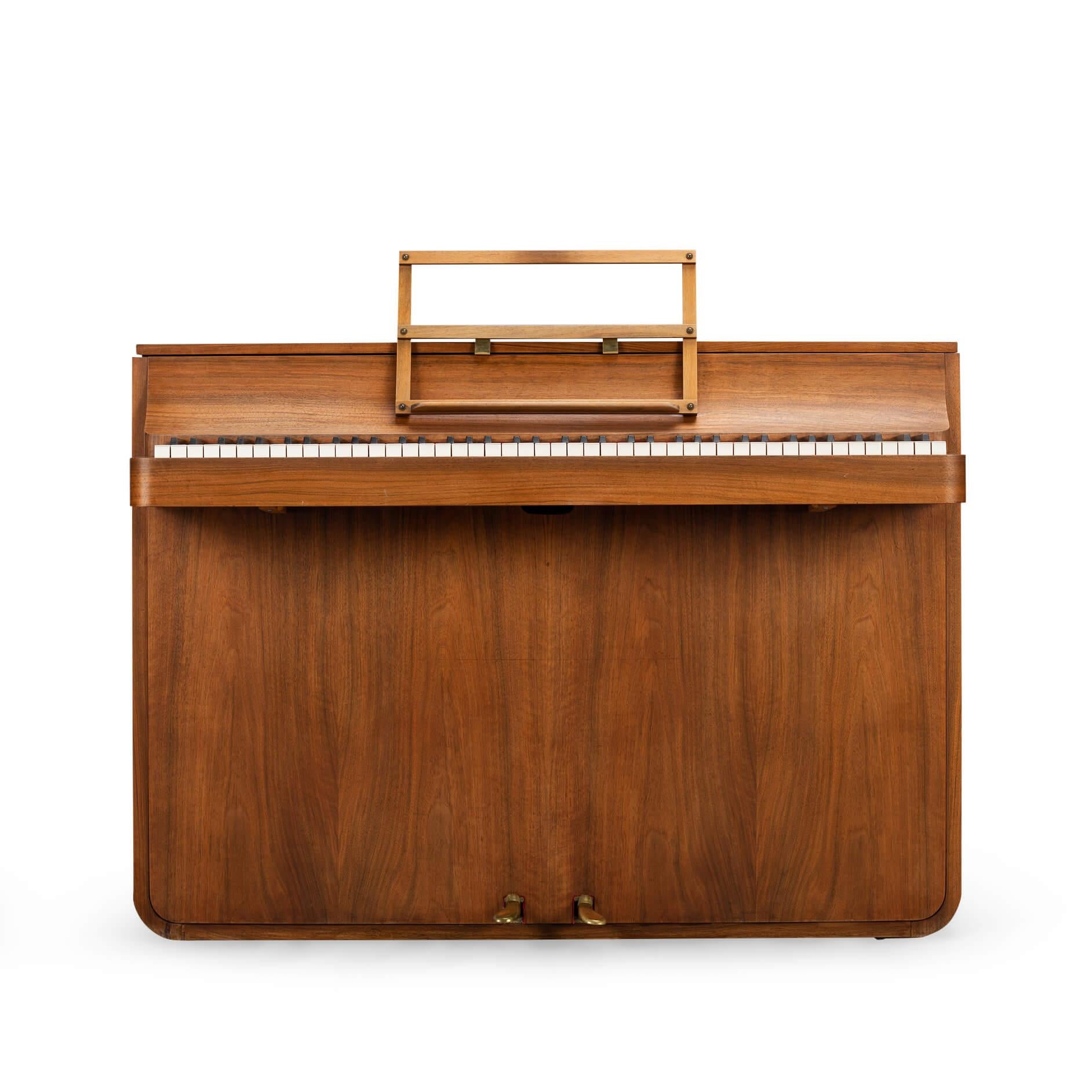 Danish design
A rare Danish midcentury pianette made of magnificent walnut. It is called pianette due to the 82 keys rather than the standard 88 of a full size piano. This pianette is made by renowned piano maker Louis Zwicki. Every piano from