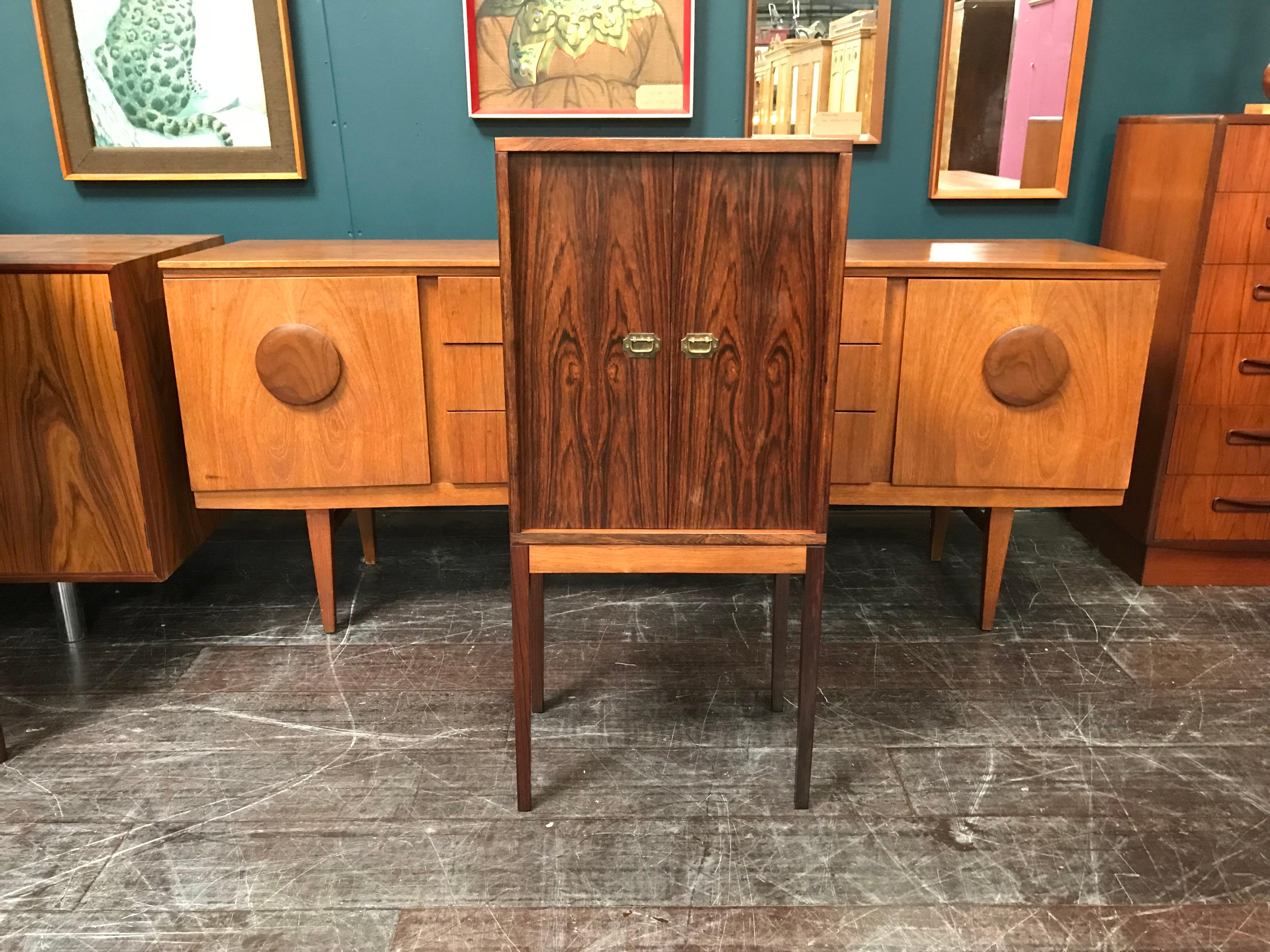 A superb and very finely made vintage cabinet, in rosewood, by the Danish designer Henning Korch and manufactured by Silkeborg Mobelfabrik in the 1960s. This Classic piece of midcentury Scandinavian furniture has some of the most impressive rosewood