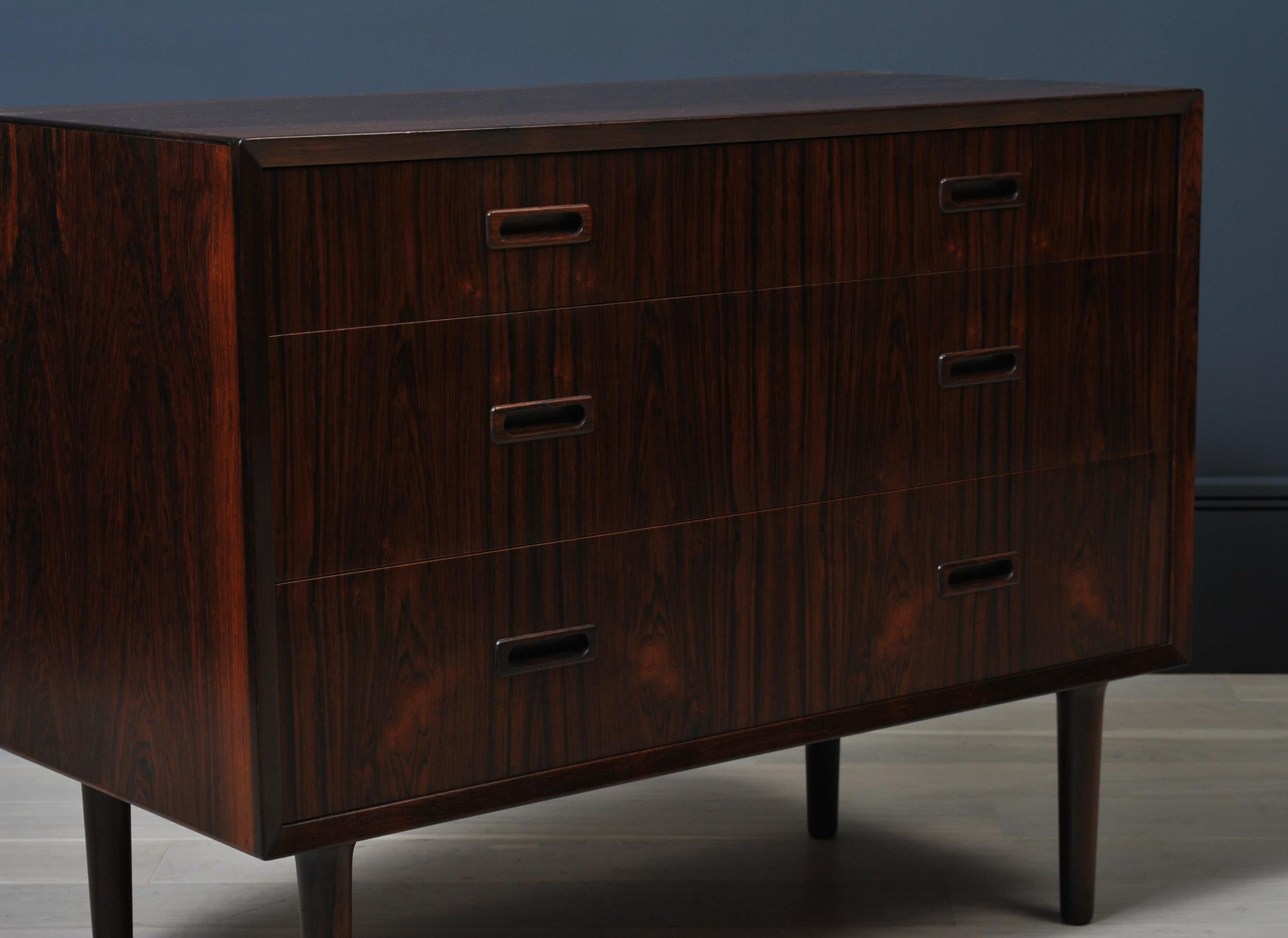 Lovely rosewood mid-size Danish midcentury chest of drawers. Produced by Lyby circa 1960.