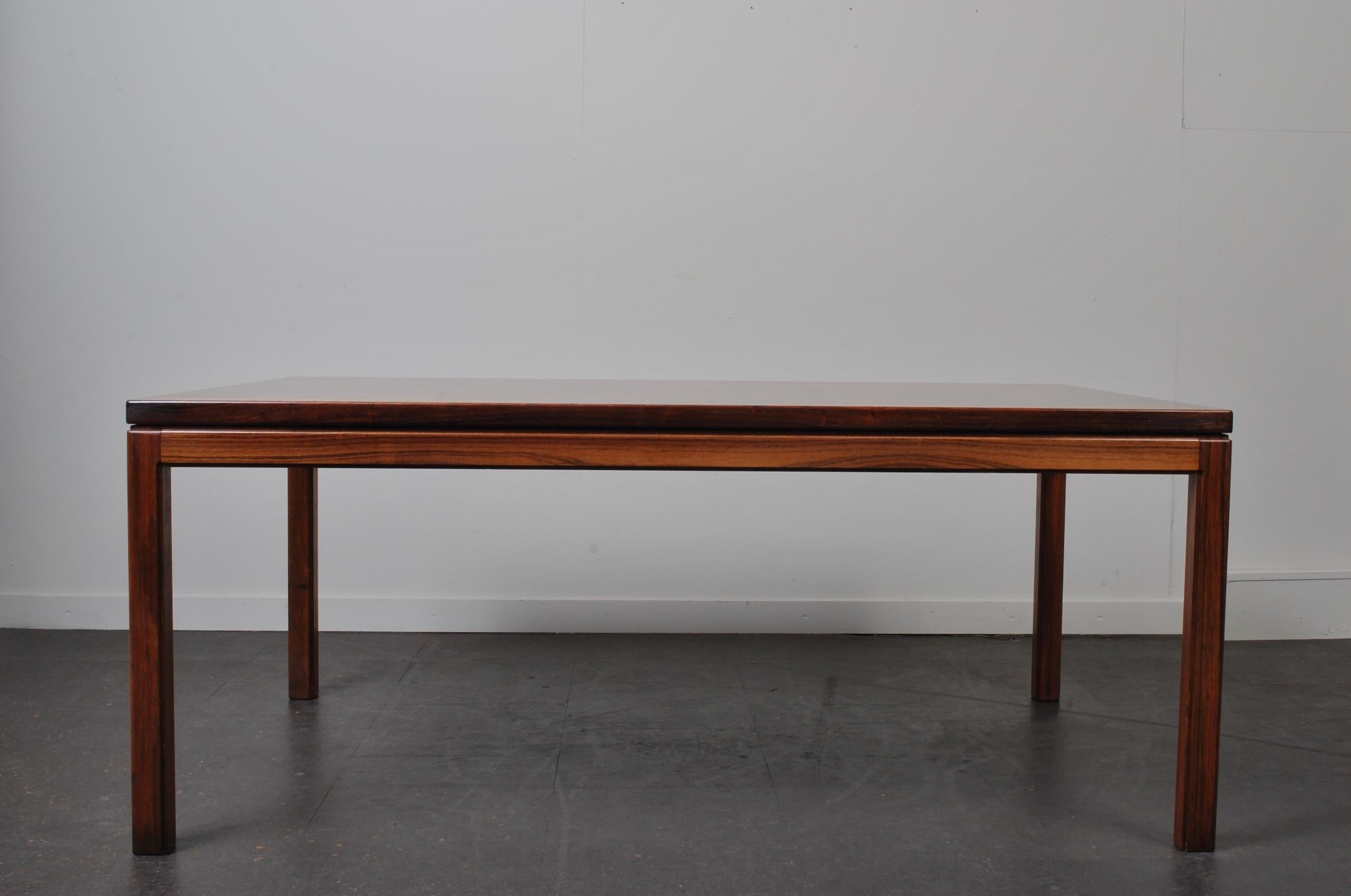 Spectacular rosewood on this large Danish midcentury rosewood coffee table. Produced in Denmark, circa 1960. Simplicity of modernist design and construction with the most amazing surface of rosewood.