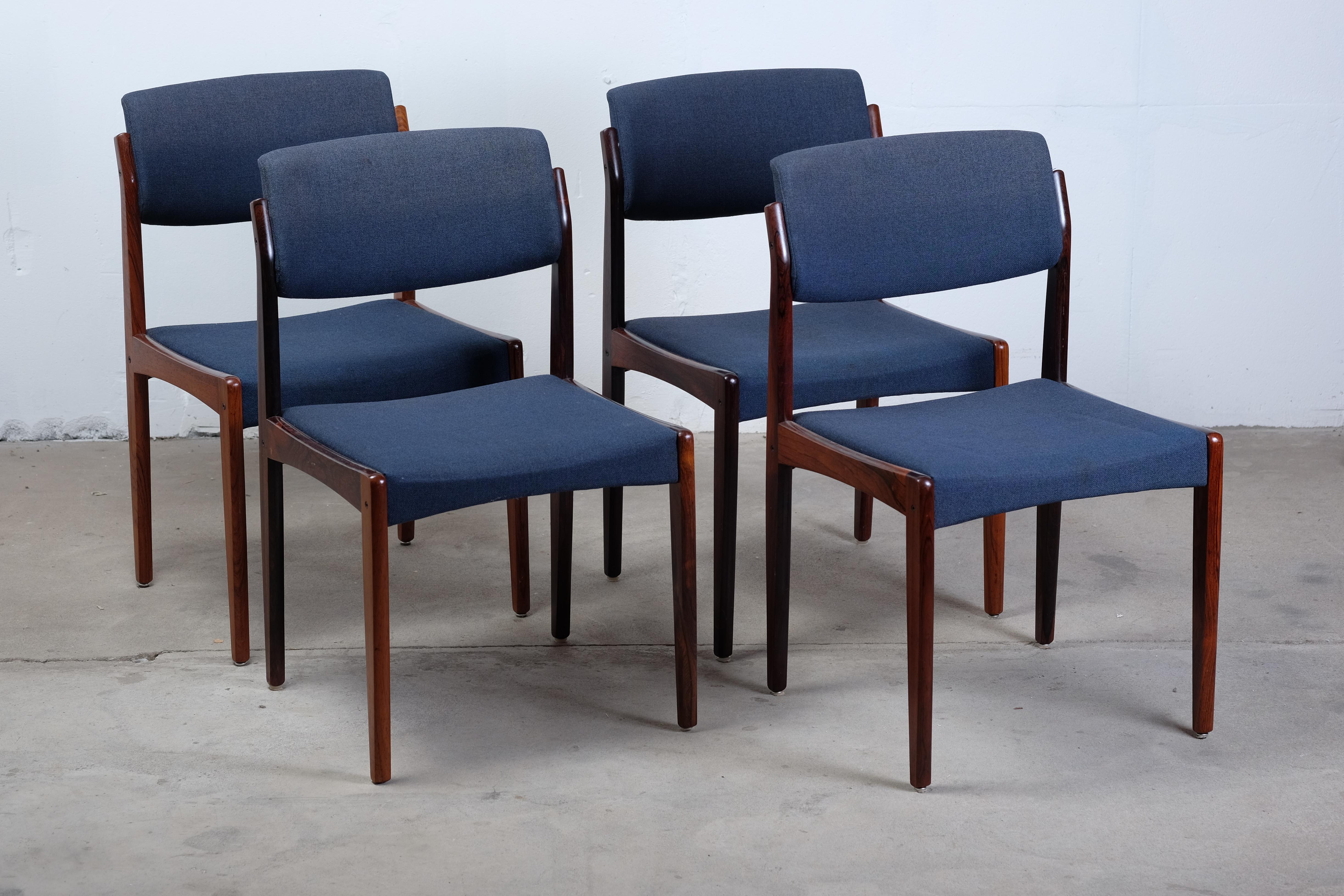 A beautiful set of four rosewood dining chairs by H.W. Klein for Bramin. H.W Klein's pieces for Bramin tend to feature really high standards of material quality. This chairs entire frame is made of solid rosewood, the backrest is upholstered making