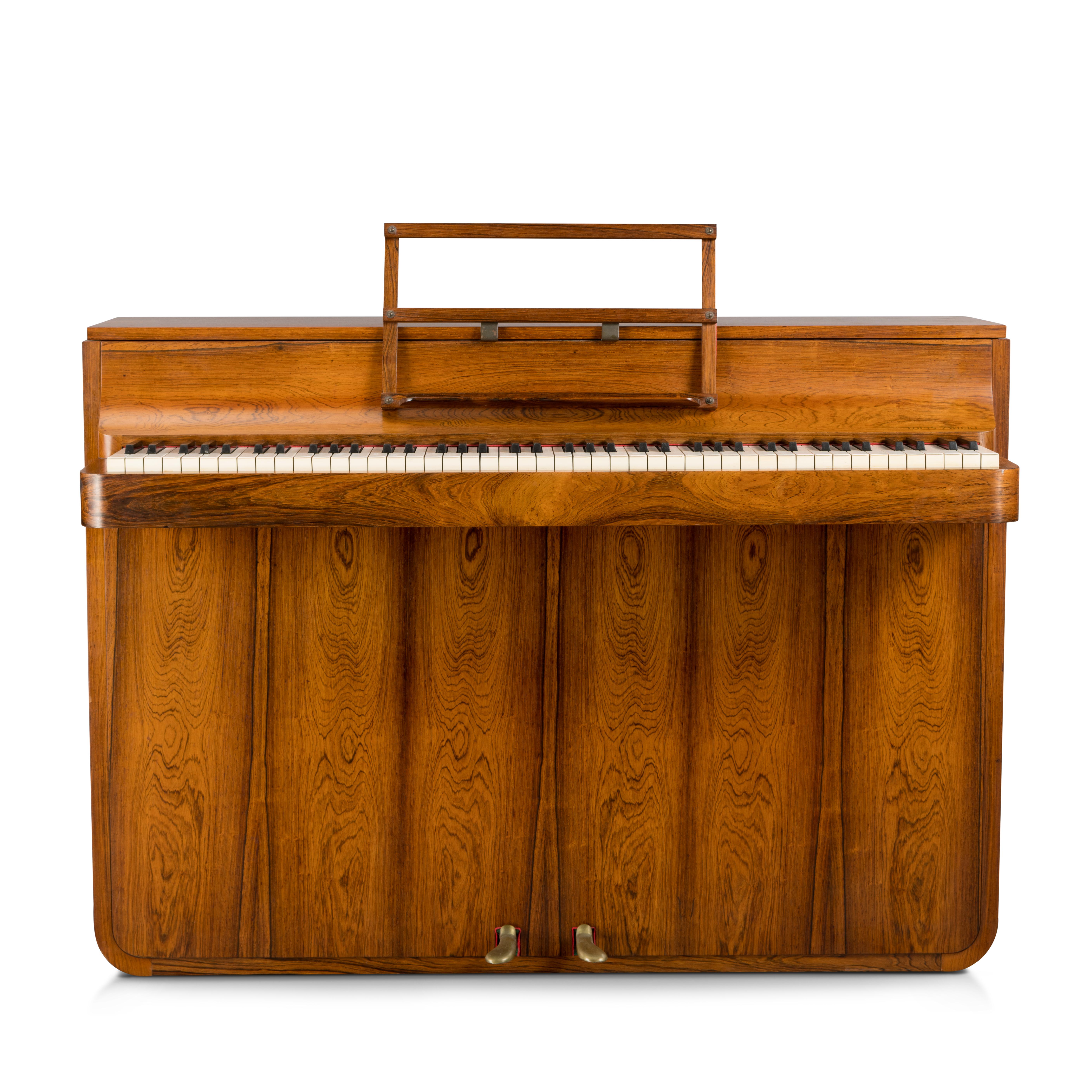 A rare Danish midcentury pianette made of magnificent wood. It is called pianette due to the 82 keys rather than the standard 88 of a full size piano. This pianette is made by renowned piano maker Louis Zwicki. This piece stands out in a modern