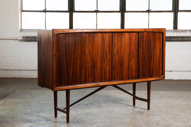 Fantastic Danish highboard manufactured sometime in the 1960 in the style and high quality of Poul Hundevad. Elegant timeless design piece with a nice size and presence about it without being imposing. The build quality is of the highest caliber