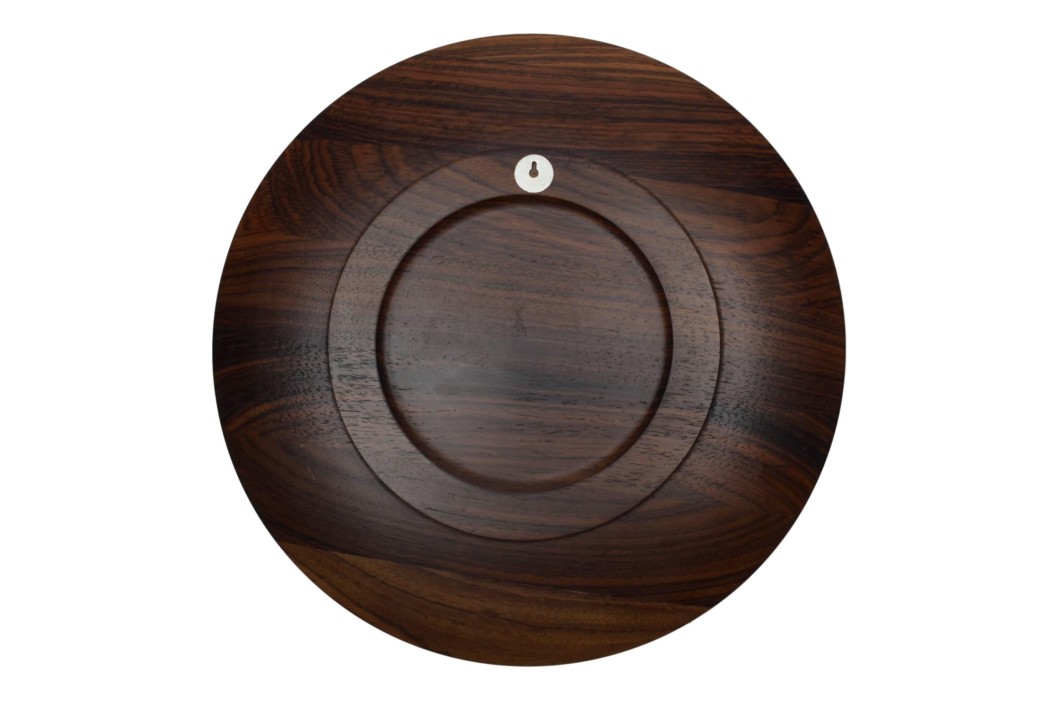 A Danish midcentury rosewood plate or wall platter with sterling silver inlays depicting a Greenlandic motive. Design by Robert Dalgas lassen.

These platters were made in a limited edition. The platters were produced in Denmark from 1970 to 1989.