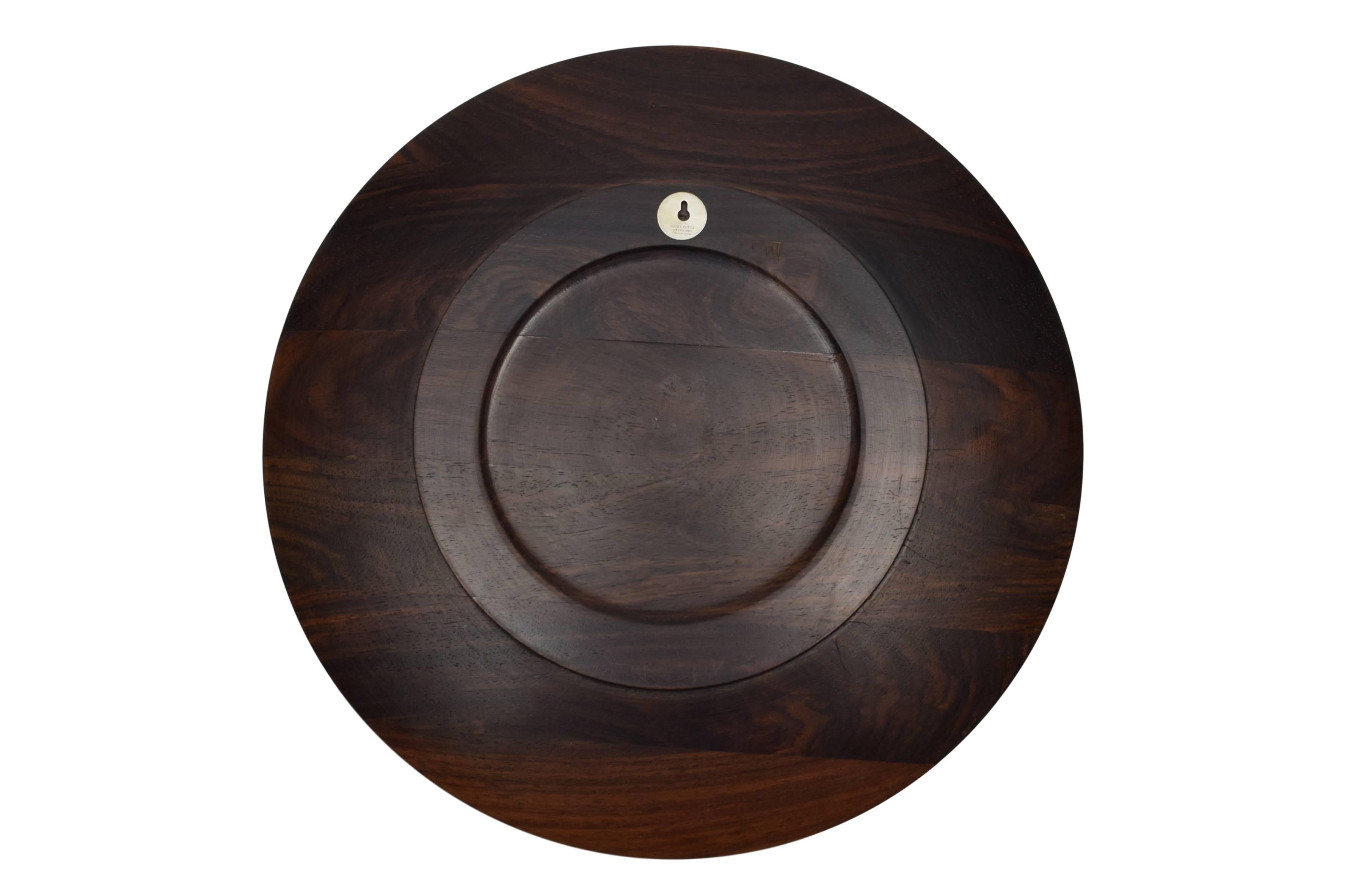 A Danish midcentury rosewood plate or wall platter with sterling silver inlays depicting a Greenlandic motive. Design by Robert Dalgas Lassen.

These platters were made in a limited edition. The platters were produced in Denmark from 1970 to 1989.
