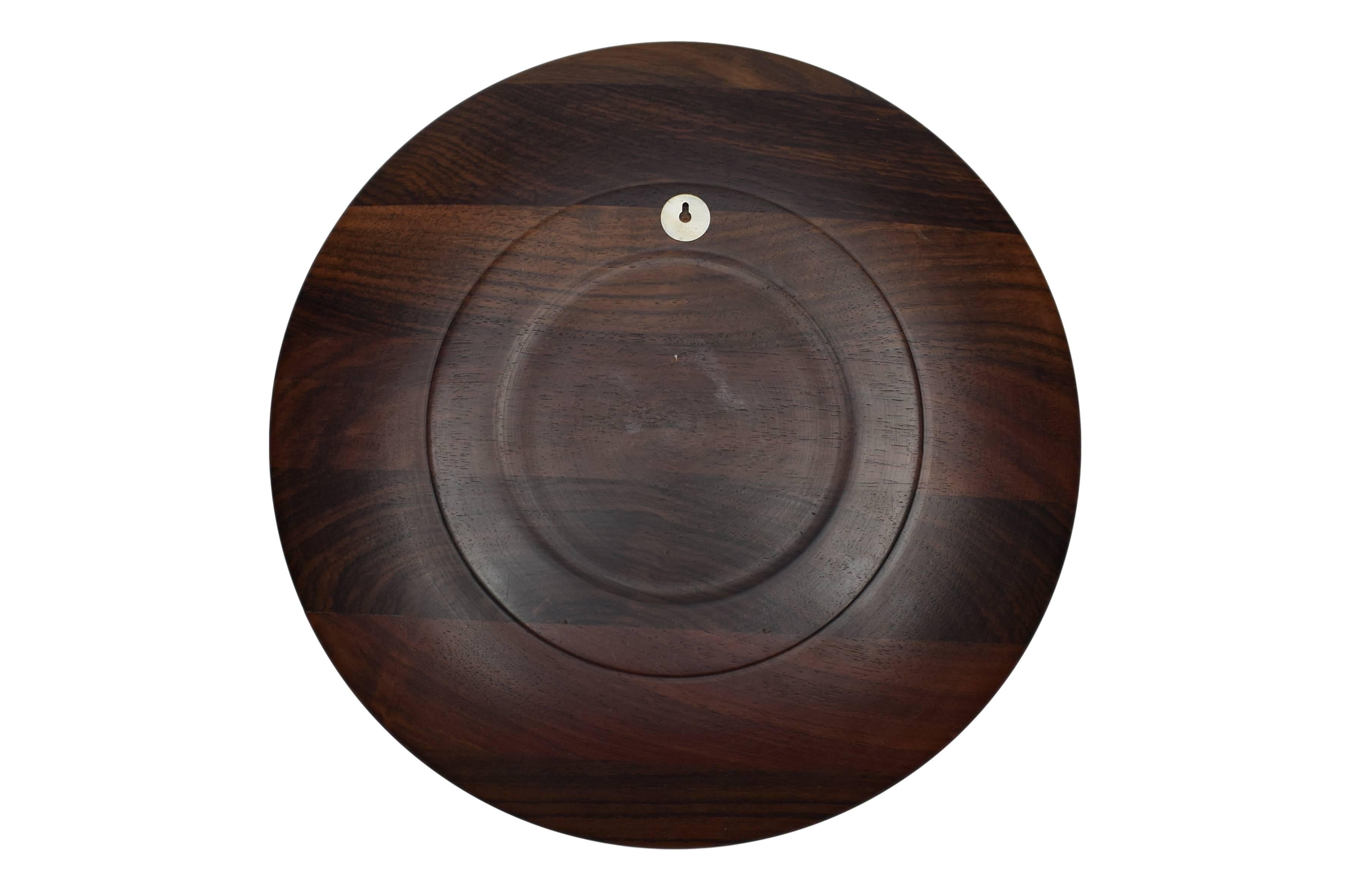 A Danish midcentury rosewood plate or wall platter with sterling silver inlays depicting a Greenlandic motive. Design by Robert Dalgas Lassen.

These platters were made in a limited edition. The platters were produced in Denmark from 1970 to 1989.