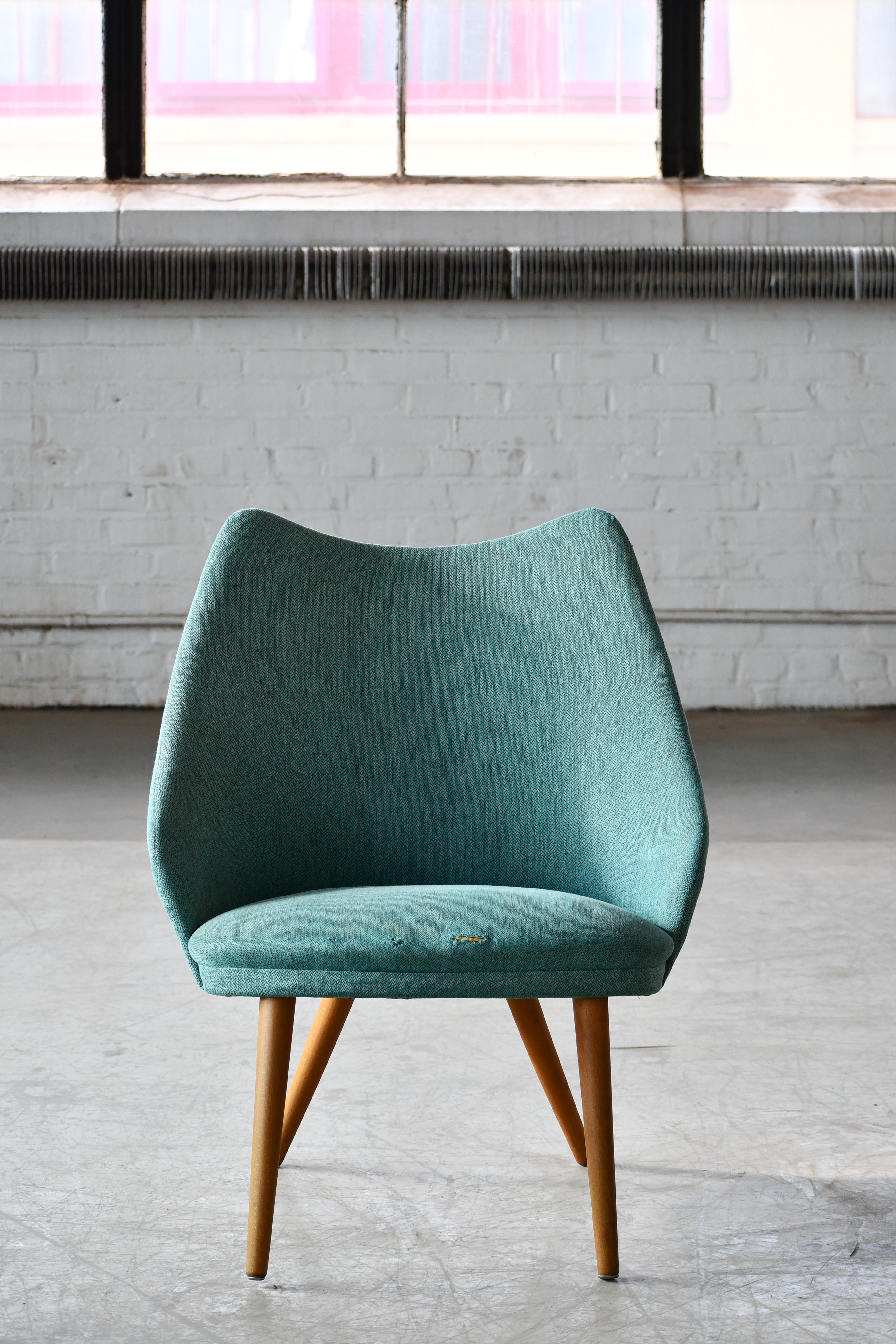 Classic small easy chair in teal wool vinyl with curved back and legs in solid teak 
very similar in design to model 301 designed by Ejvind A. Johansson for  Gotfred H. Petersen in 1958. Nice light very versatile design and easy to move around when