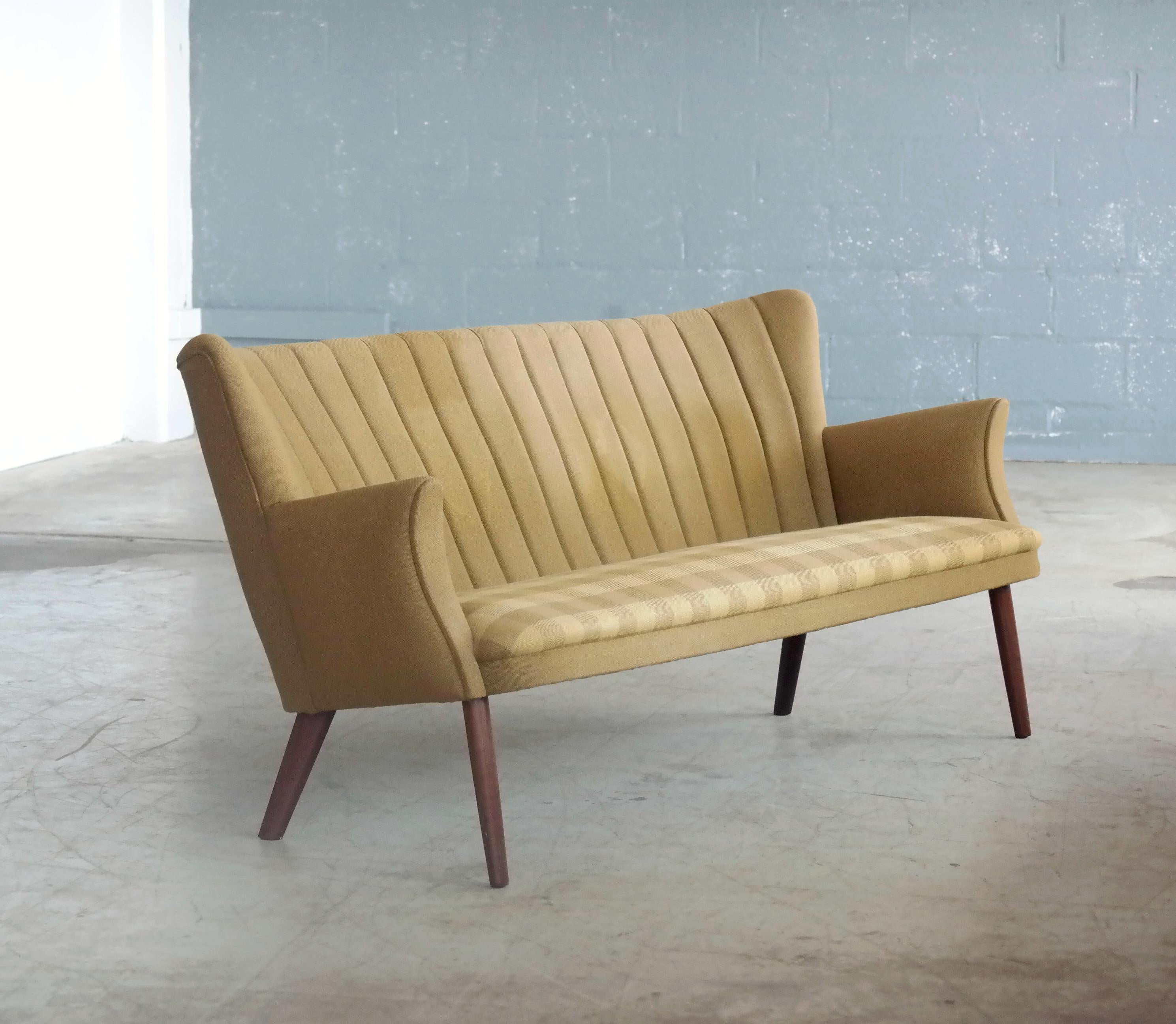 Iconic midcentury settee and a rare find the model 