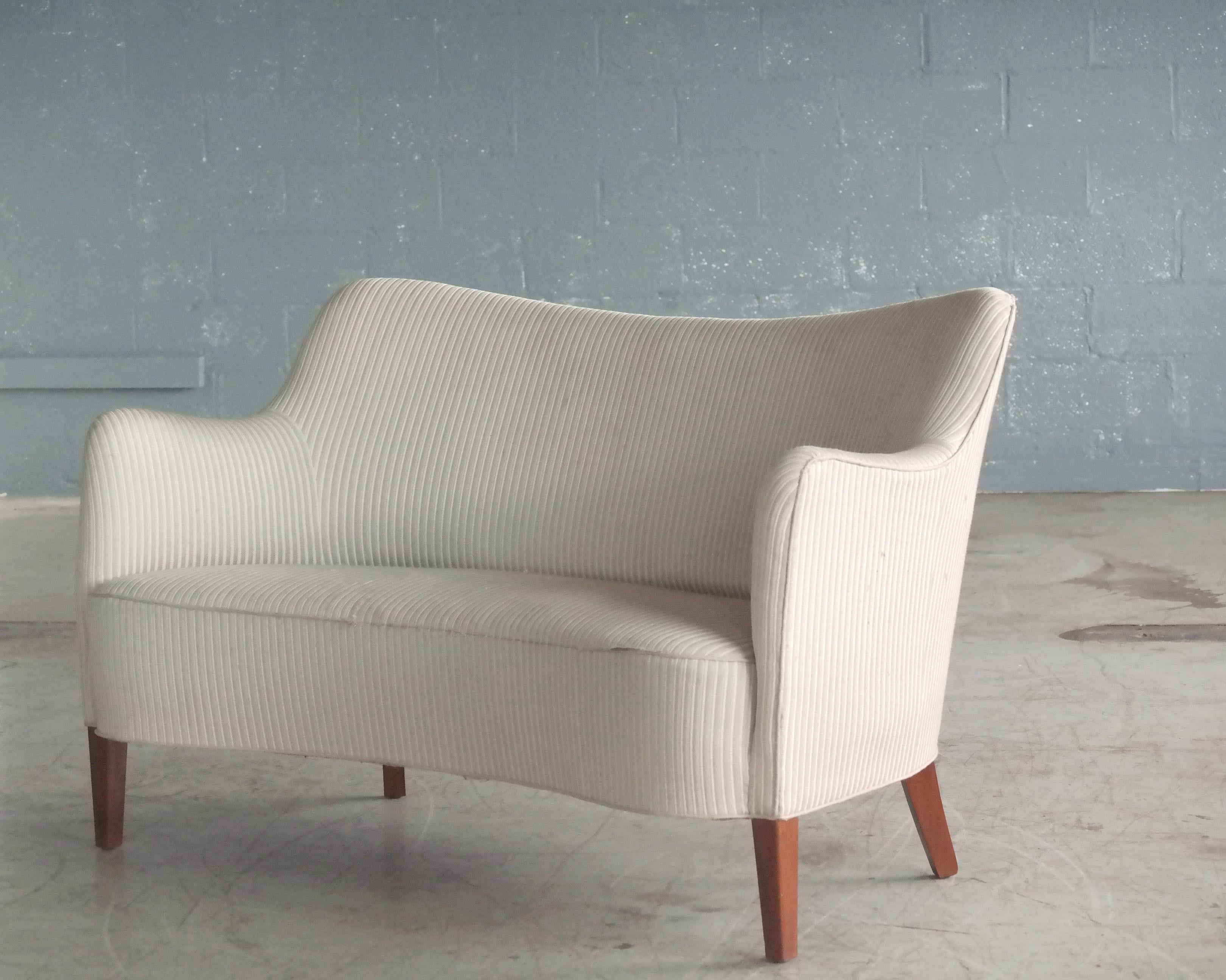 Beautiful and rare Danish settee or loveseat known as the 