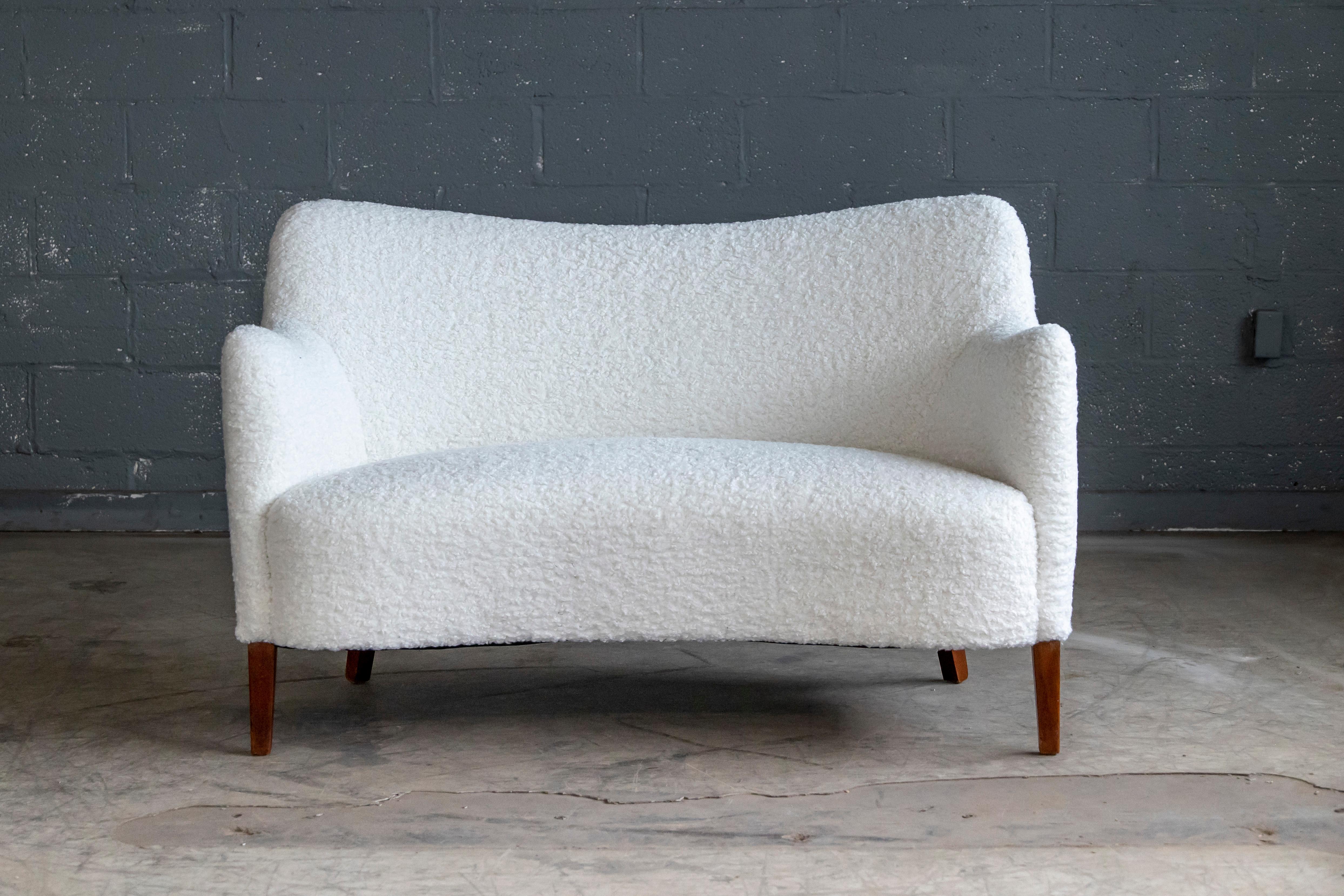 Beautiful and rare Danish settee or loveseat known as the 