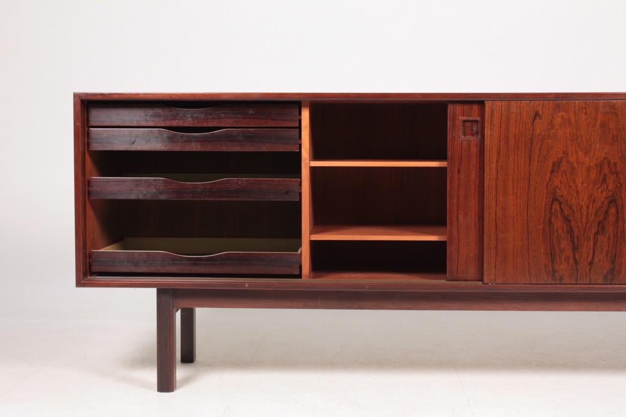 Great looking sideboard in rosewood designed by Gunni Omann for Omann Jun, Denmark in 1960s. Great original condition.