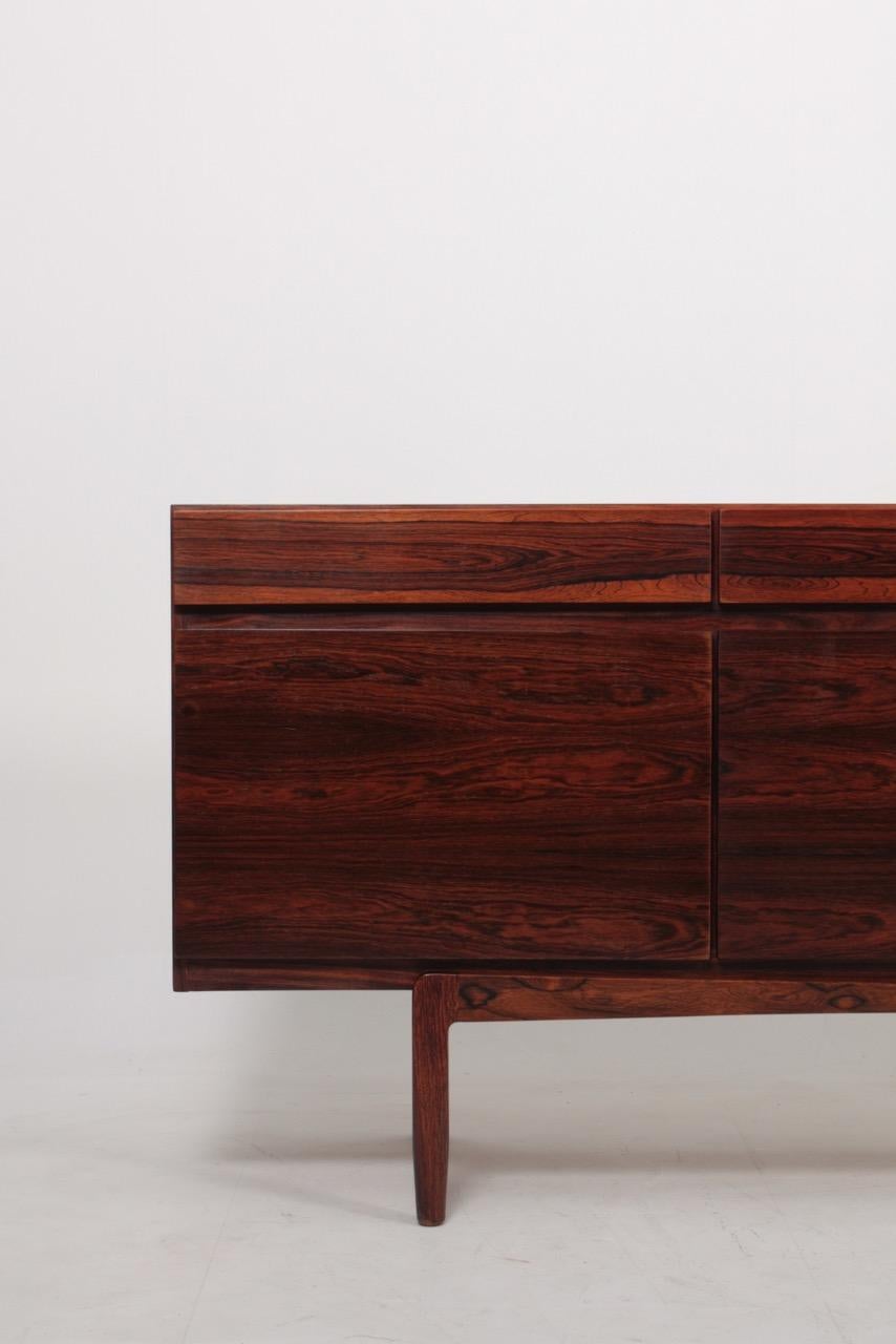 Great looking sideboard in rosewood designed by Maa. Ib Kofod-Larsen. Made by Faarup Møbelfabrik. Model no.66. Original condition.
