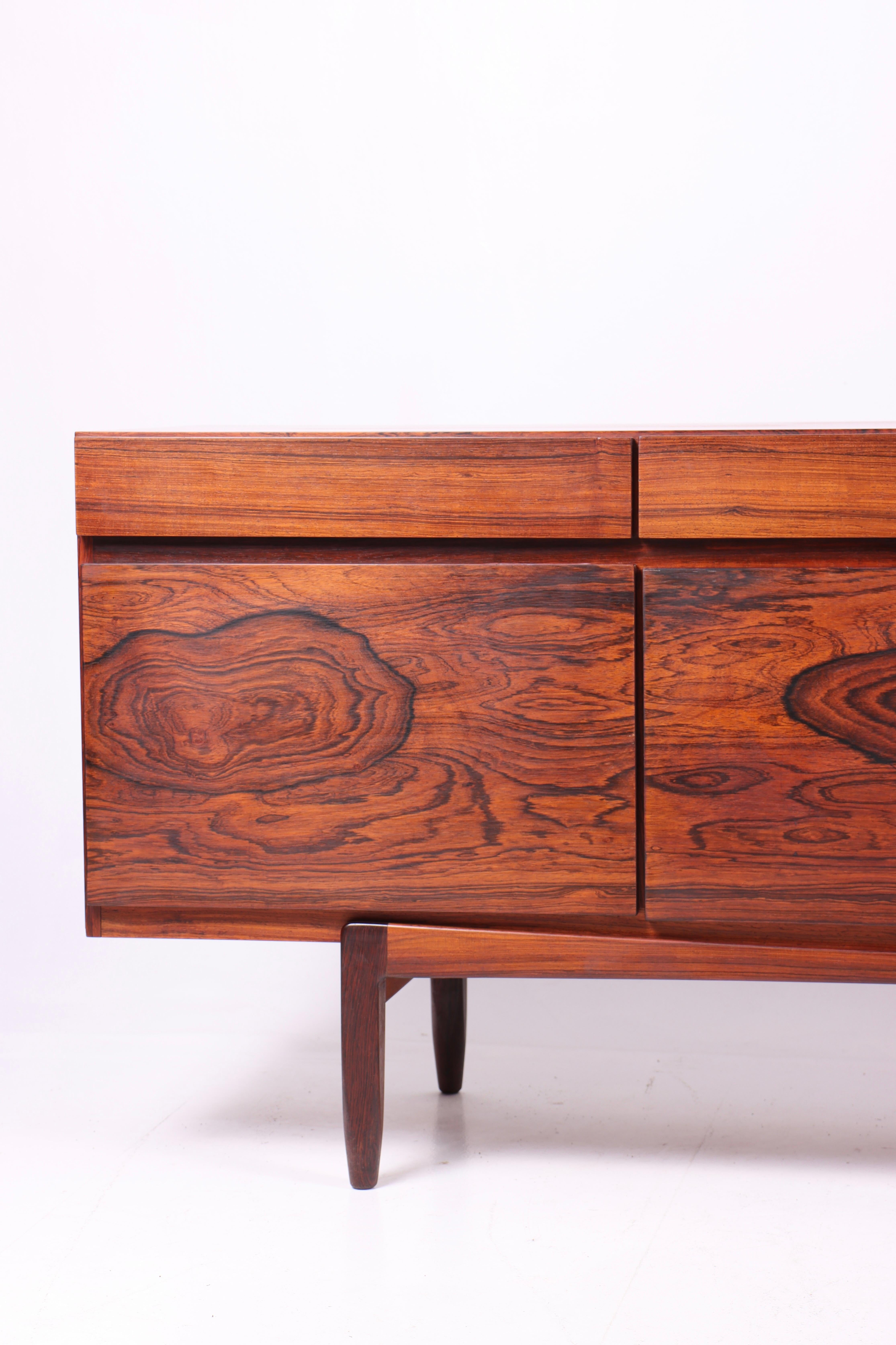 Great looking sideboard in rosewood designed by Maa. Ib Kofod-Larsen. Made by Faarup Møbelfabrik. Model no.66. Original condition.