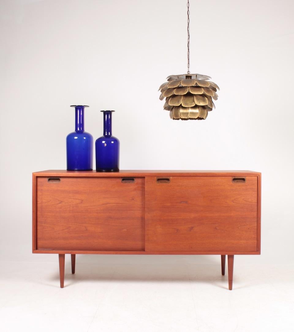 Great looking sideboard in teak, designed and made in Denmark in 1960s. Great original condition.