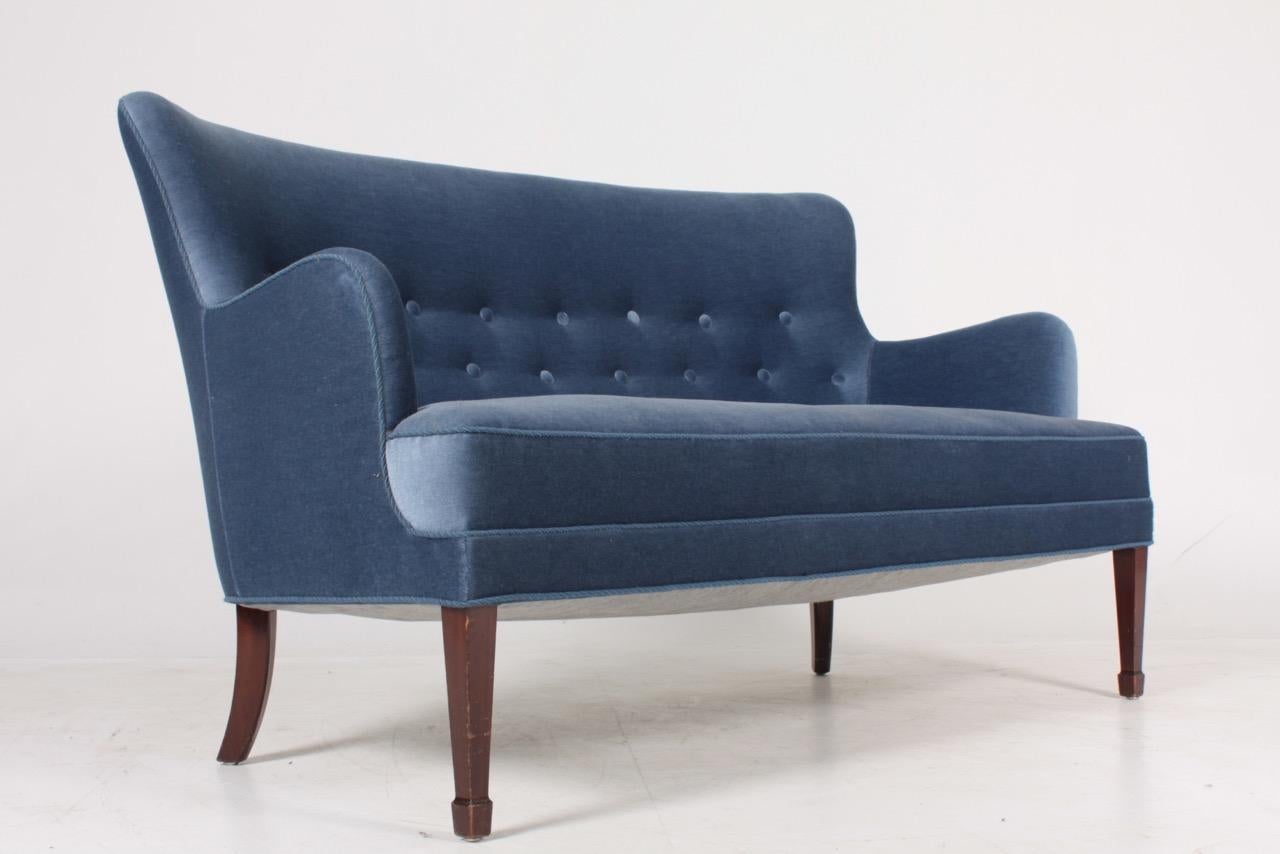 Midcentury sofa upholstered in French velvet. Designed by Danish architect Frits Henningsen. Made in Denmark. Great condition.