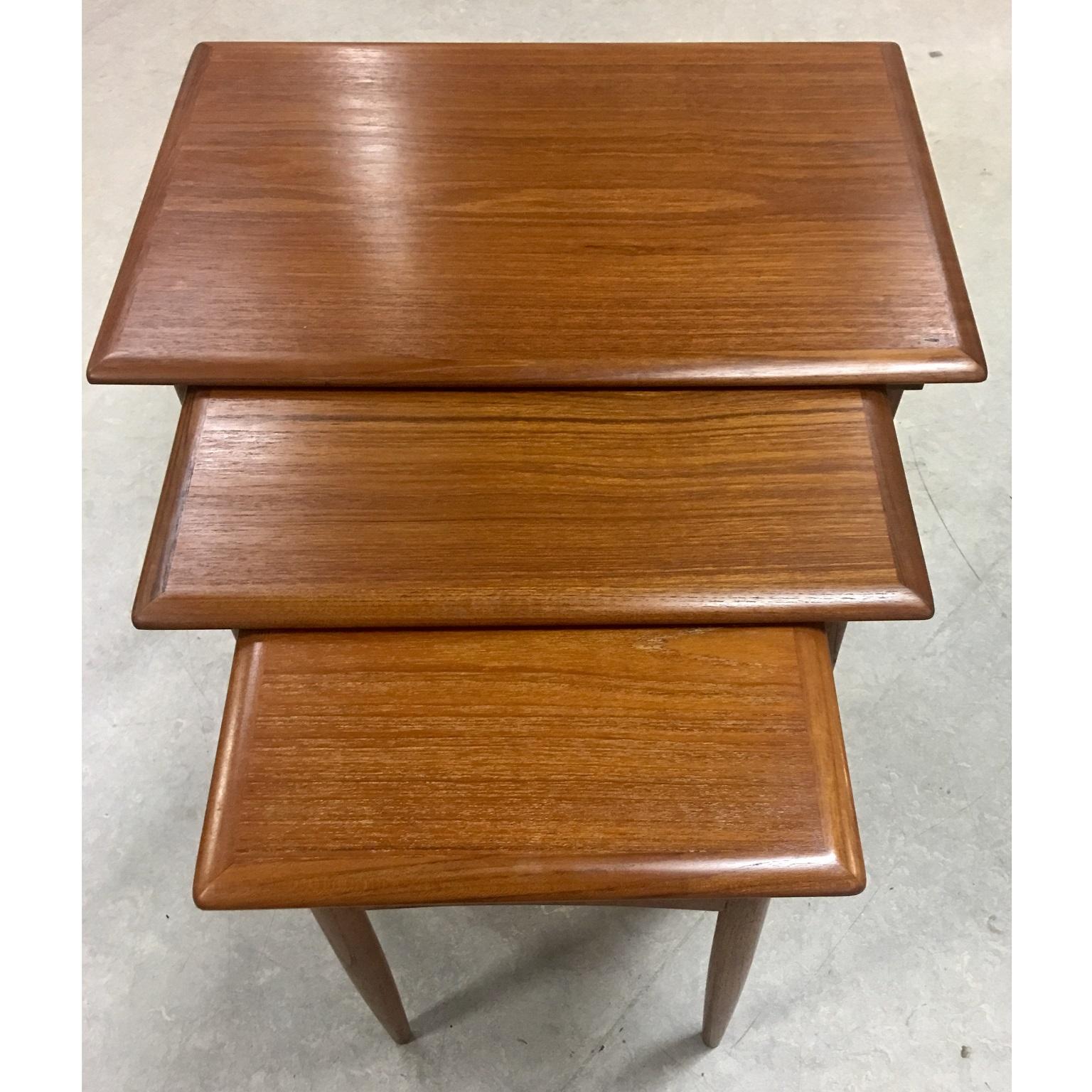 Danish midcentury teak nesting tables by Poul Hundevad, circa 1960s.

A nest of three teak nesting tables designed by Poul Hundevad and manufactured by Fabian in Denmark. Beautiful tapered legs and curved stretchers, the small and medium table