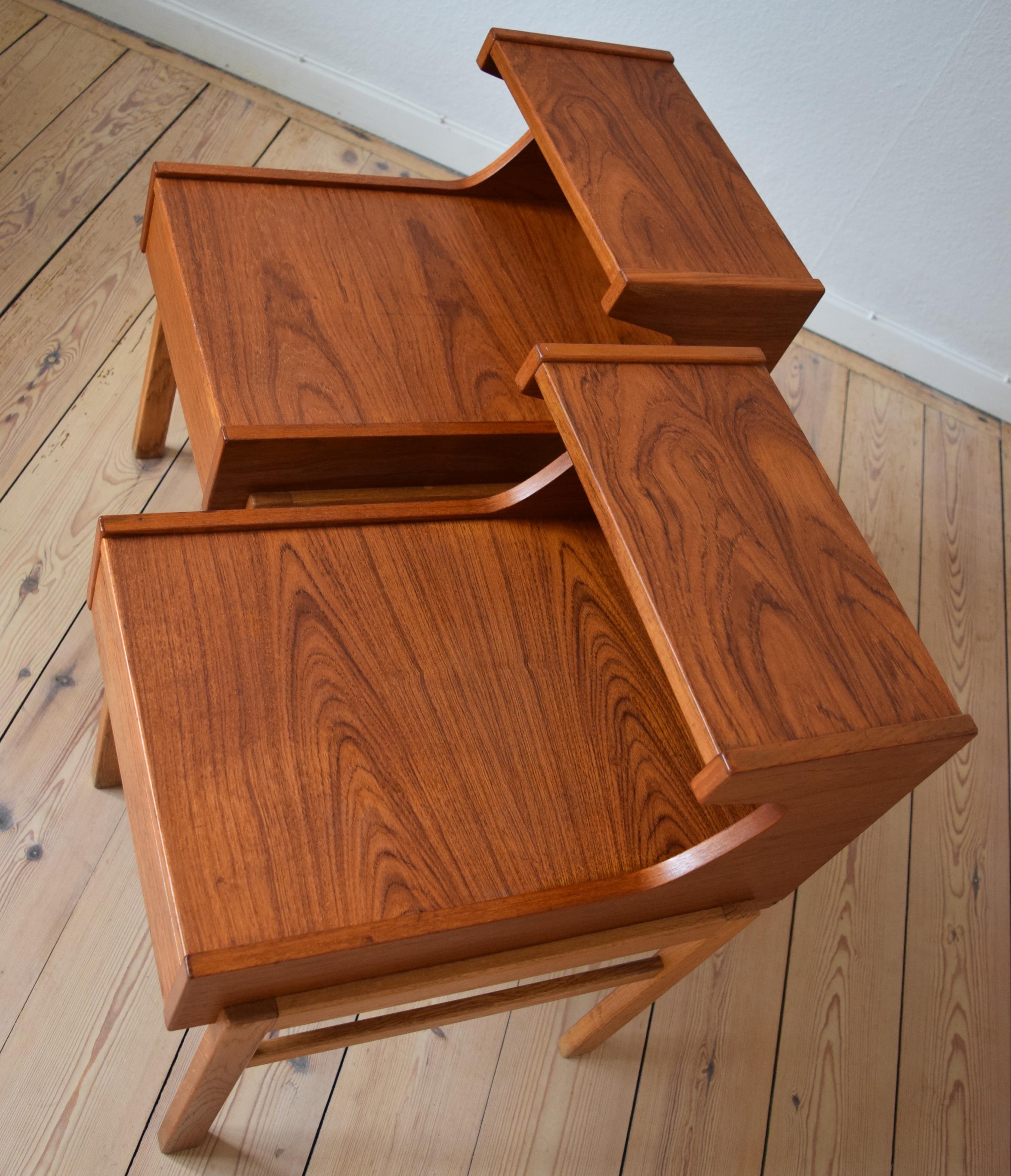 Set of teak night tables manufactured in Denmark in the 1960s. Each unit features a drawer and stacked top-plates. The tables sit on oak frame base legs. Apart from a few minor marks these tables are in a very good vintage condition.