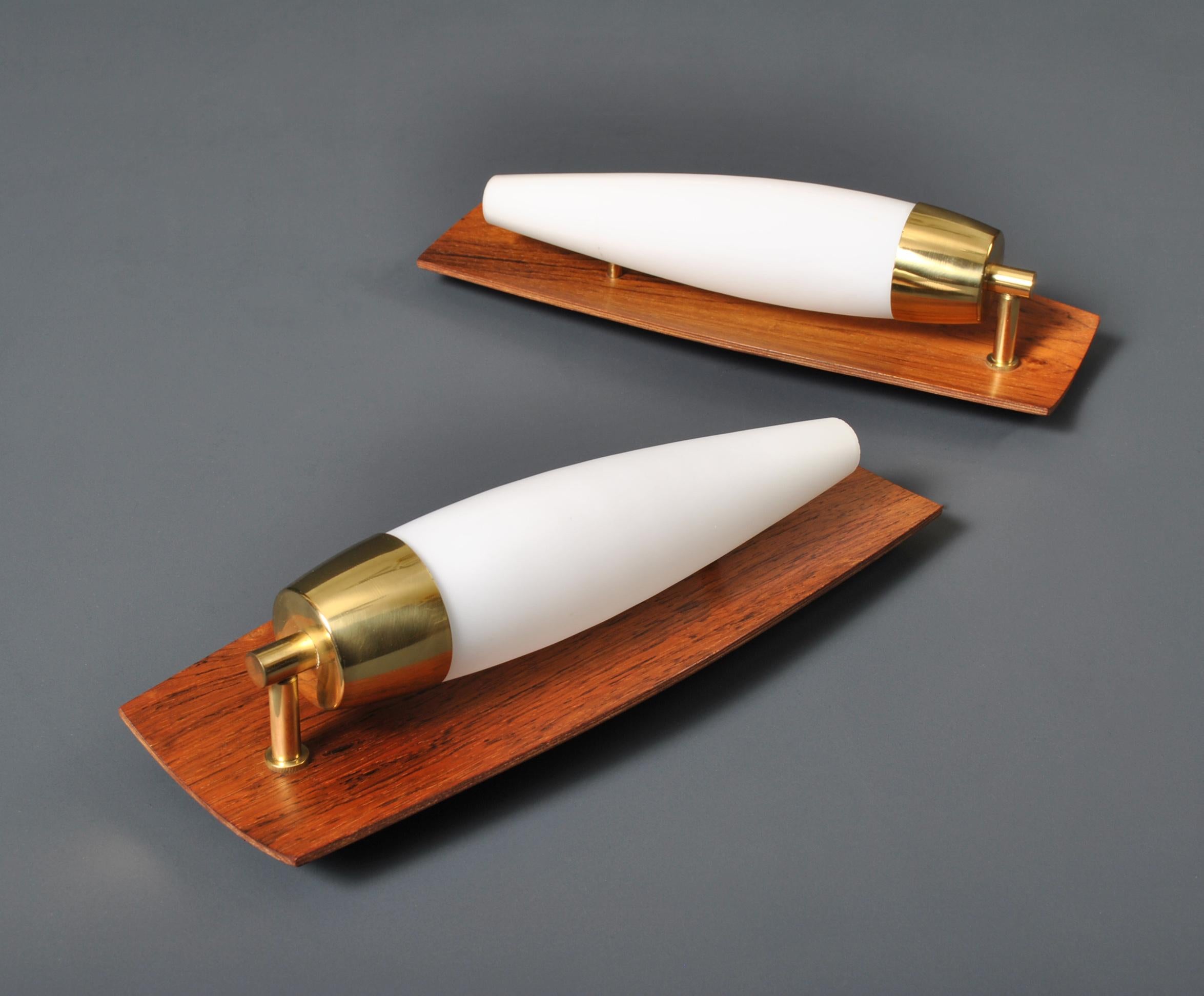 A pair of Modernist Teak, Brass and glass wall lights. Produced in Denmark circa 1960.