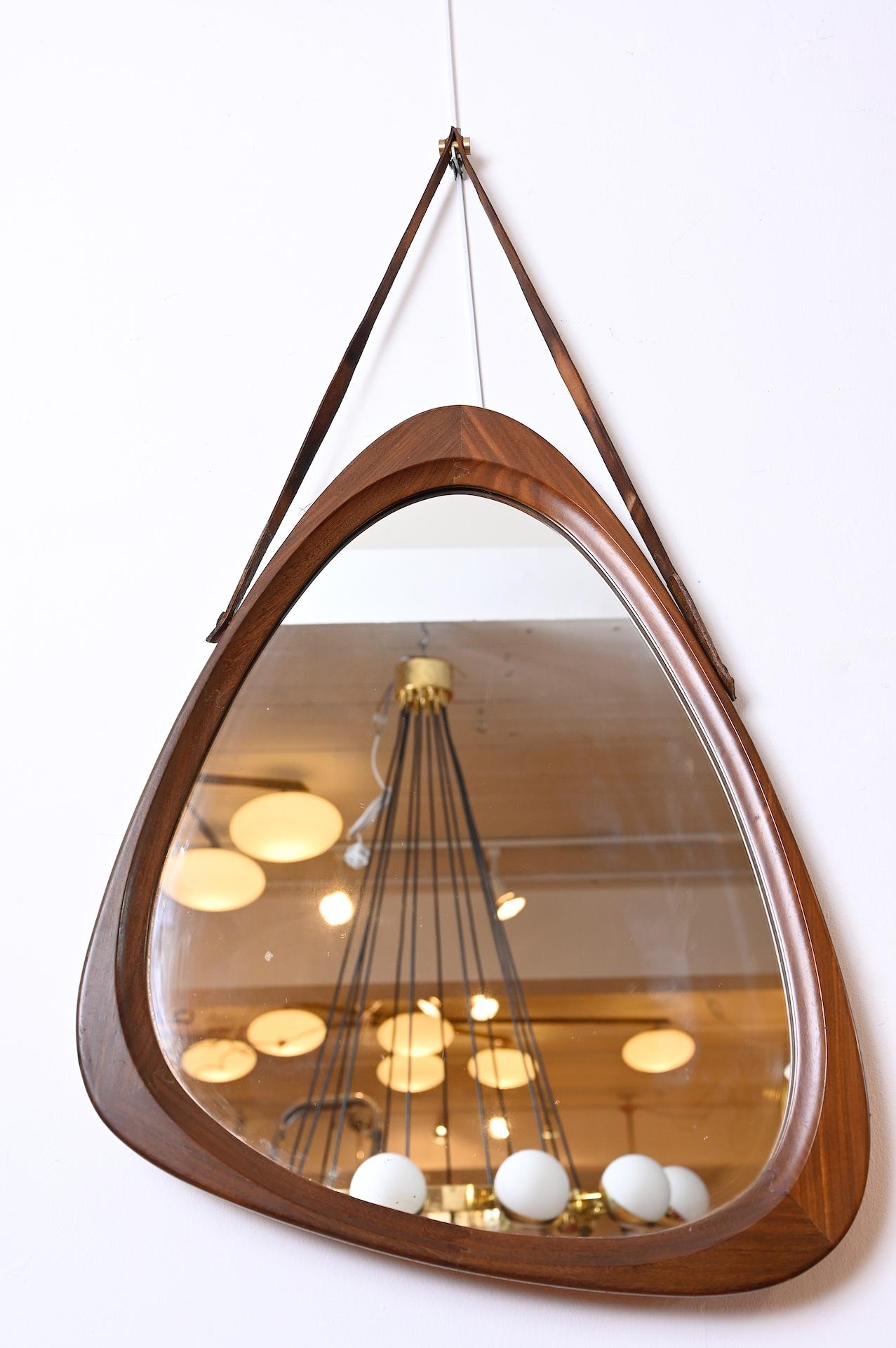 Nice quality Danish mirror with leather strap and brass details

Measures: Actual mirror 63cm x 70cm x 53cm
with strap 90cm.