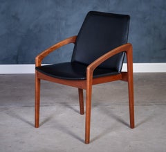 Danish Model 23 Armchair in Teak and Black Leather by Henning Kjærnulf, 1960s D