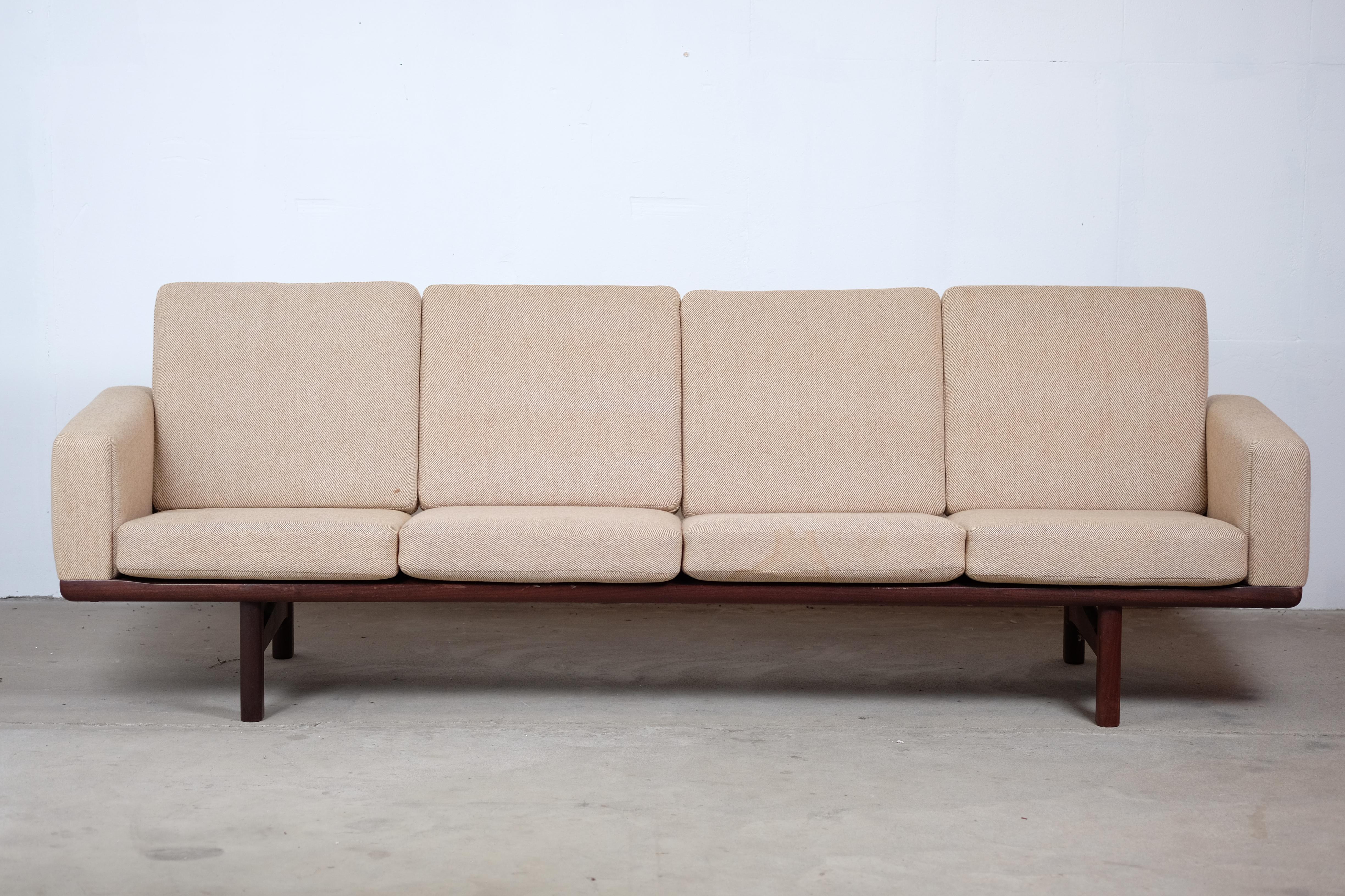 An great sofa designed by Hans Wegner for GETAMA Gedsted. This sofa's versatility made it to one of Wegner's most popular sofa designs. The rear of the sofa is absolutely beautiful. The angled posts give this sofa its modern flare and are