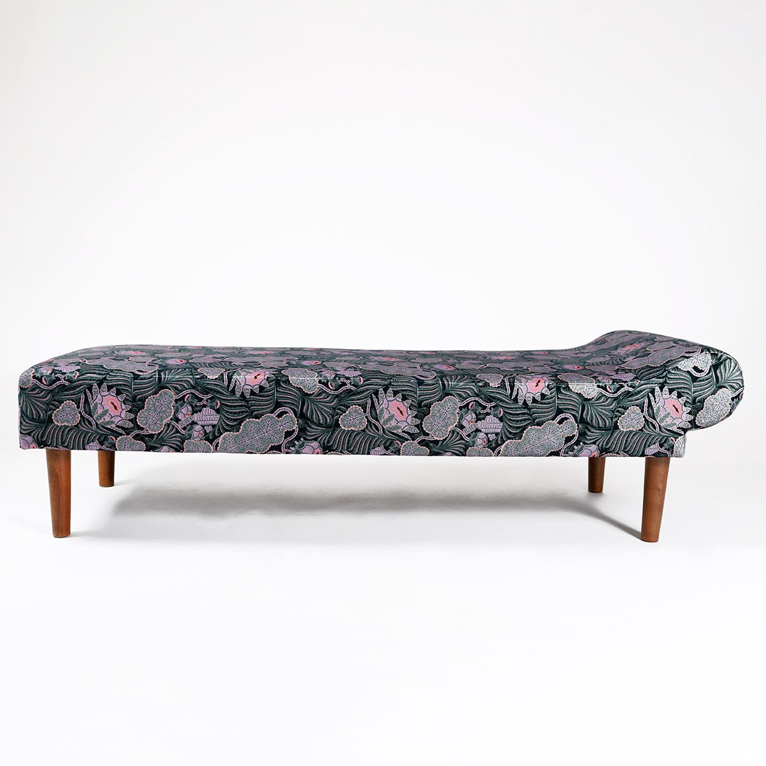 A 1940s Scandinavian designed daybed. Recently reupholstered in a playful textile designed by Klaus Haapaniemi called 
